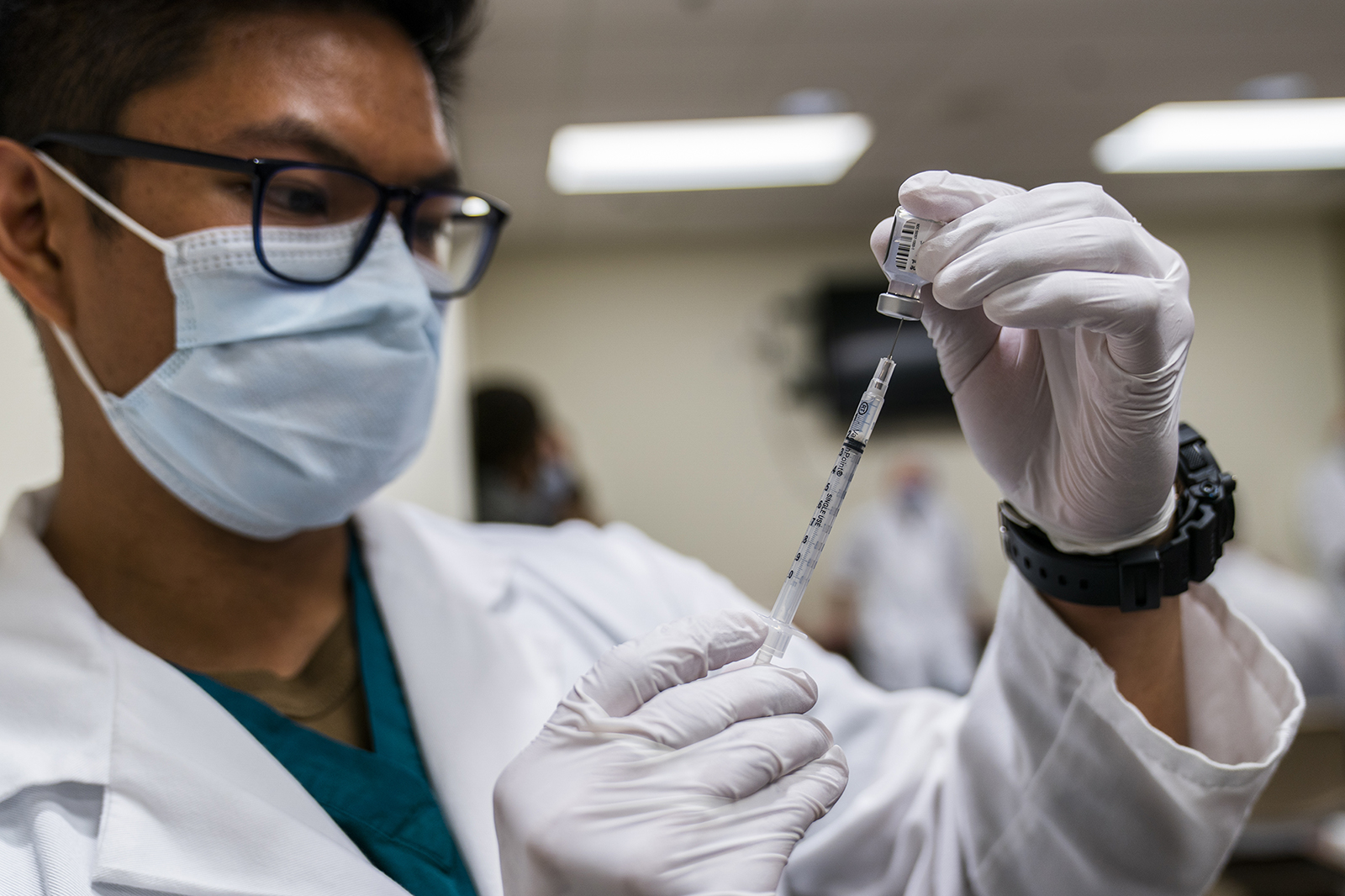 HN Milan Torres prepares a dose of Covid-19 vaccine at the Walter Reed National Military Medical Center on December 14, in Bethesda, Maryland.