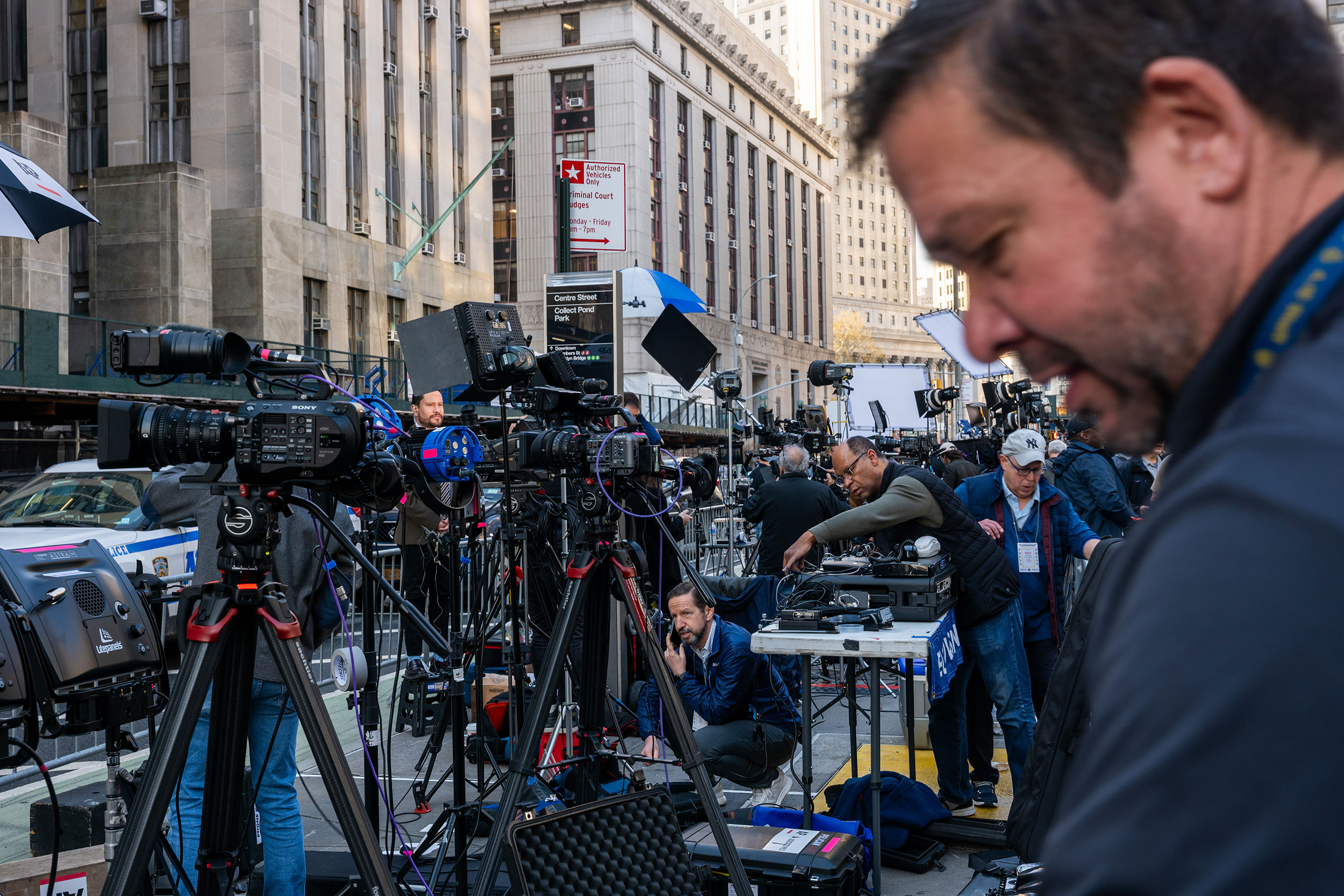 Members of the media gather outside of Manhattan Criminal Court on Monday morning.