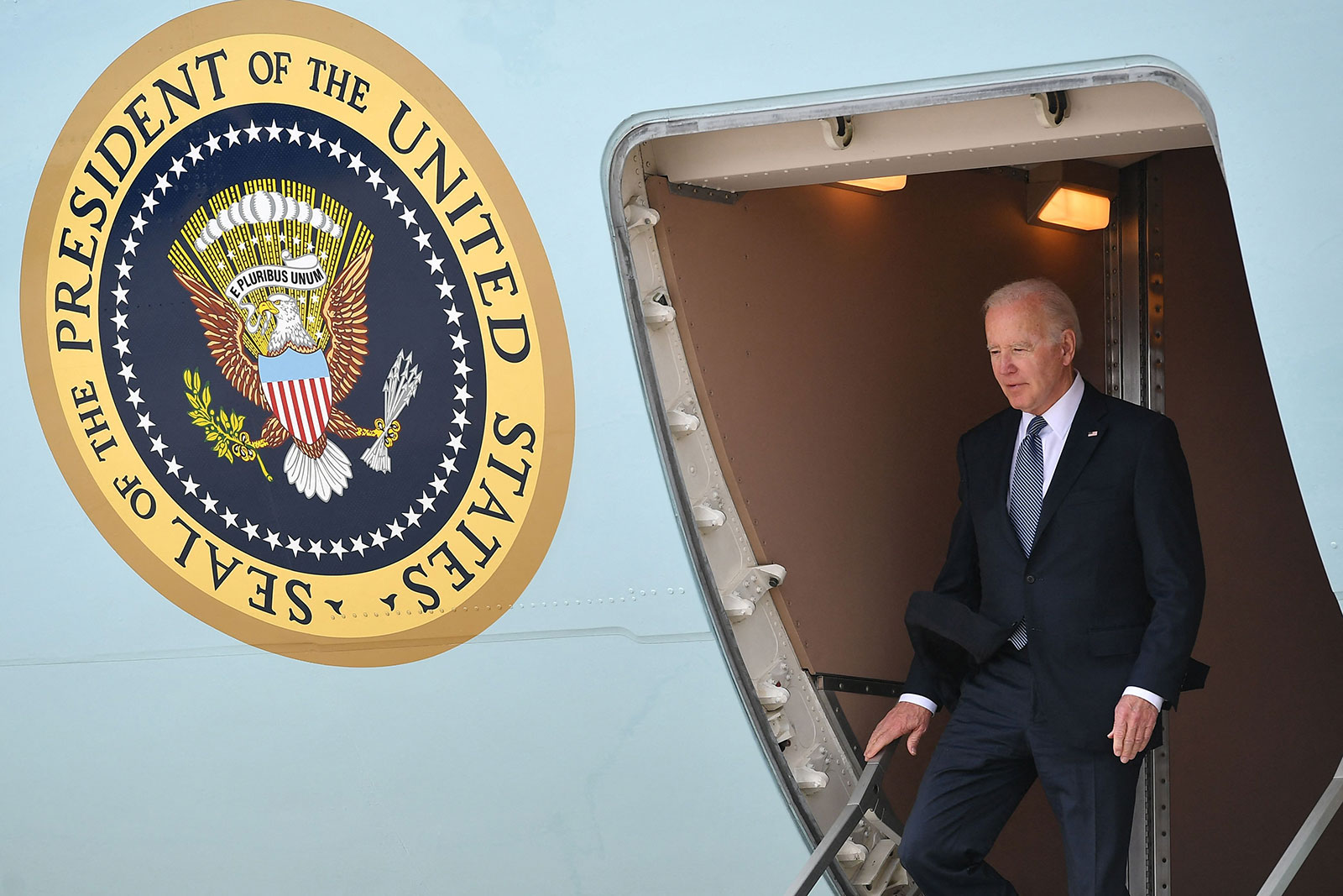US President Joe Biden steps off Air Force One upon arrival at Portsmouth International Airport at Pease in Portsmouth, New Hampshire, on Tuesday, April 19.