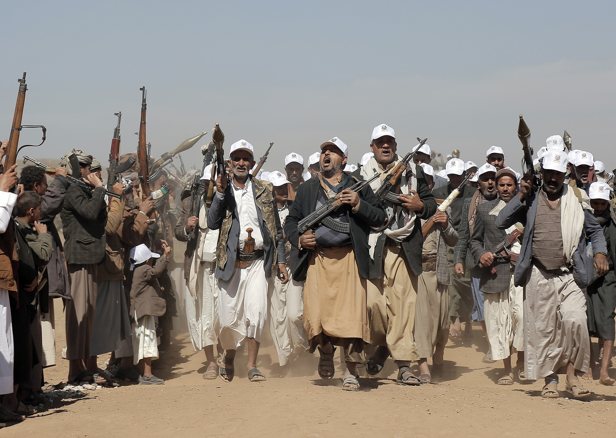 Houthi fighters march during a rally of support for the Palestinians in the Gaza Strip and against the U.S. strikes on Yemen outside Sanaa, Yemen, on January 22.