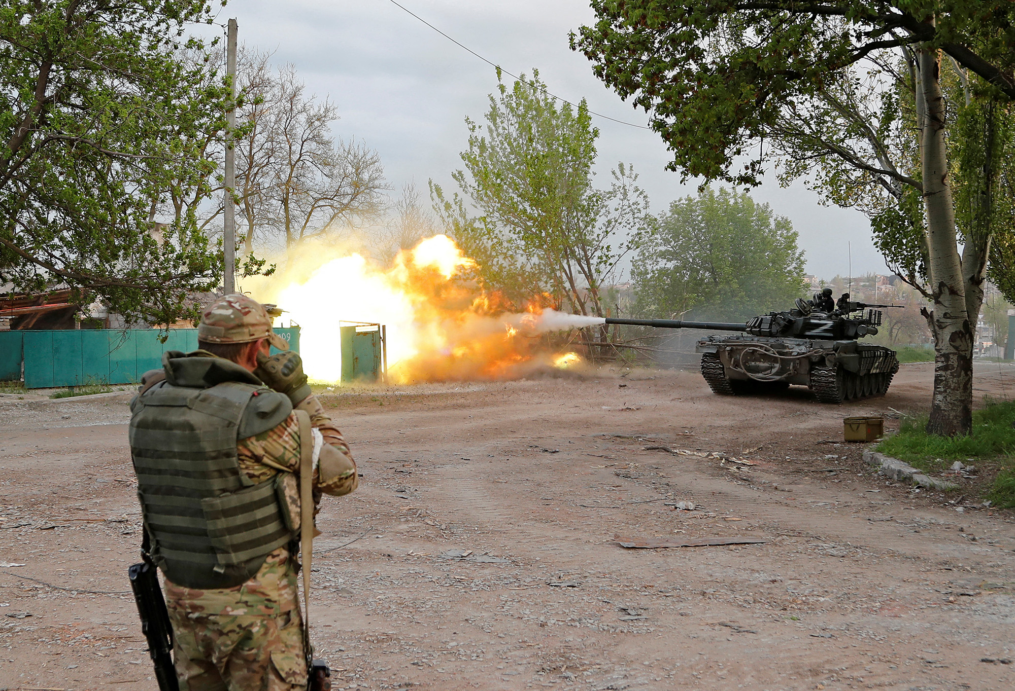 Service members of pro-Russian troops fire from a tank during fighting near the Azovstal steel plant in the southern port city of Mariupol, Ukraine, on May 5.