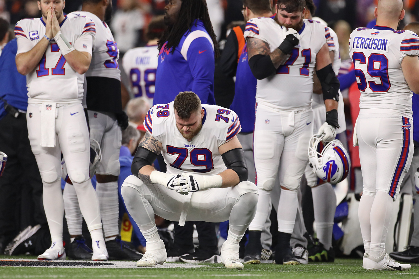 Buffalo Bills offensive tackle Spencer Brown #79 reacts as teammate Damar Hamlin is examined.