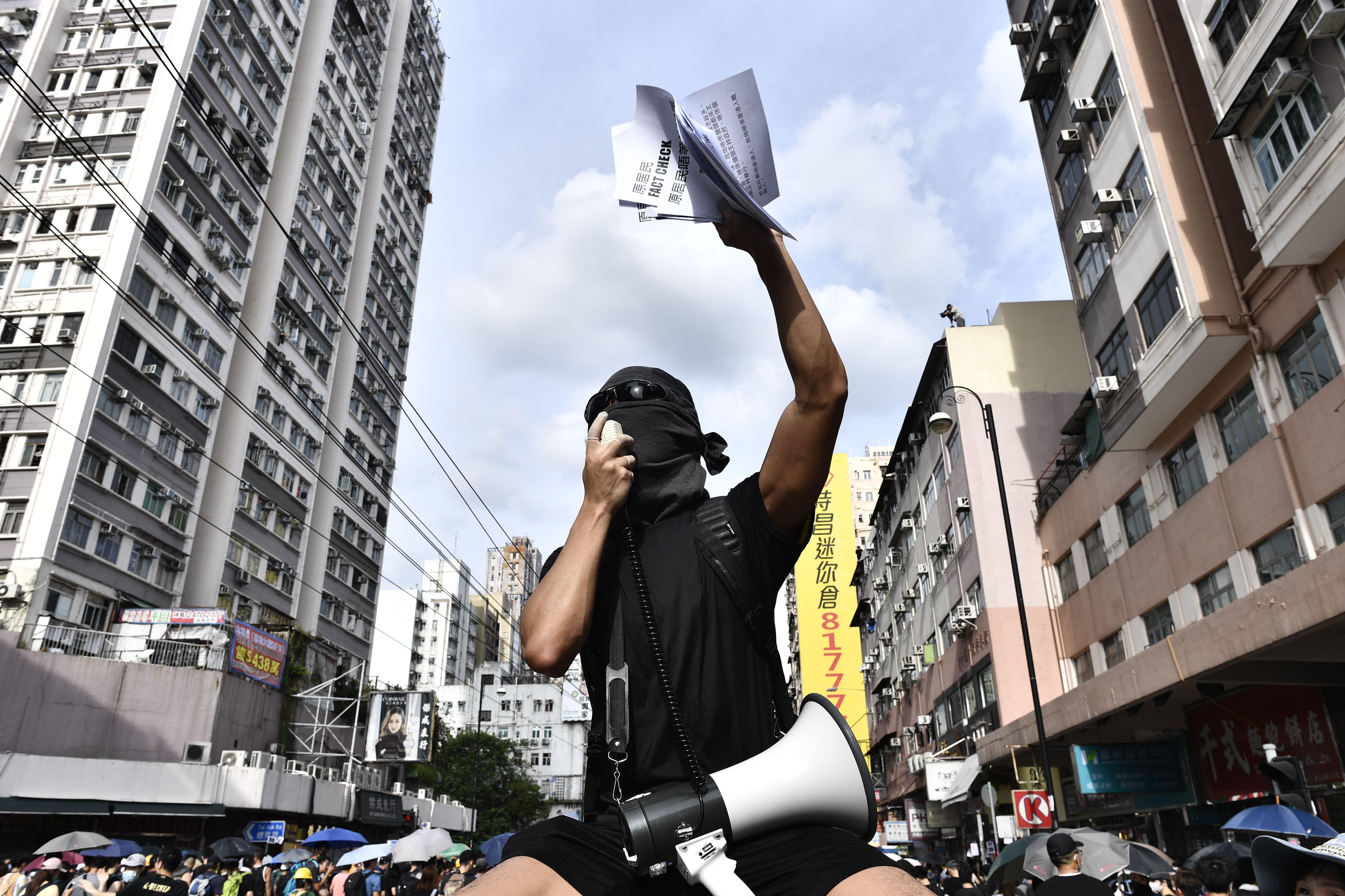Protesters demonstrate in the district of Yuen Long in Hong Kong on July 27.