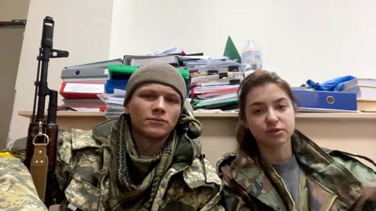 Newlyweds Yaryna Arieva (right) and Sviatoslav Fursin have taken up arms to defend Ukraine.