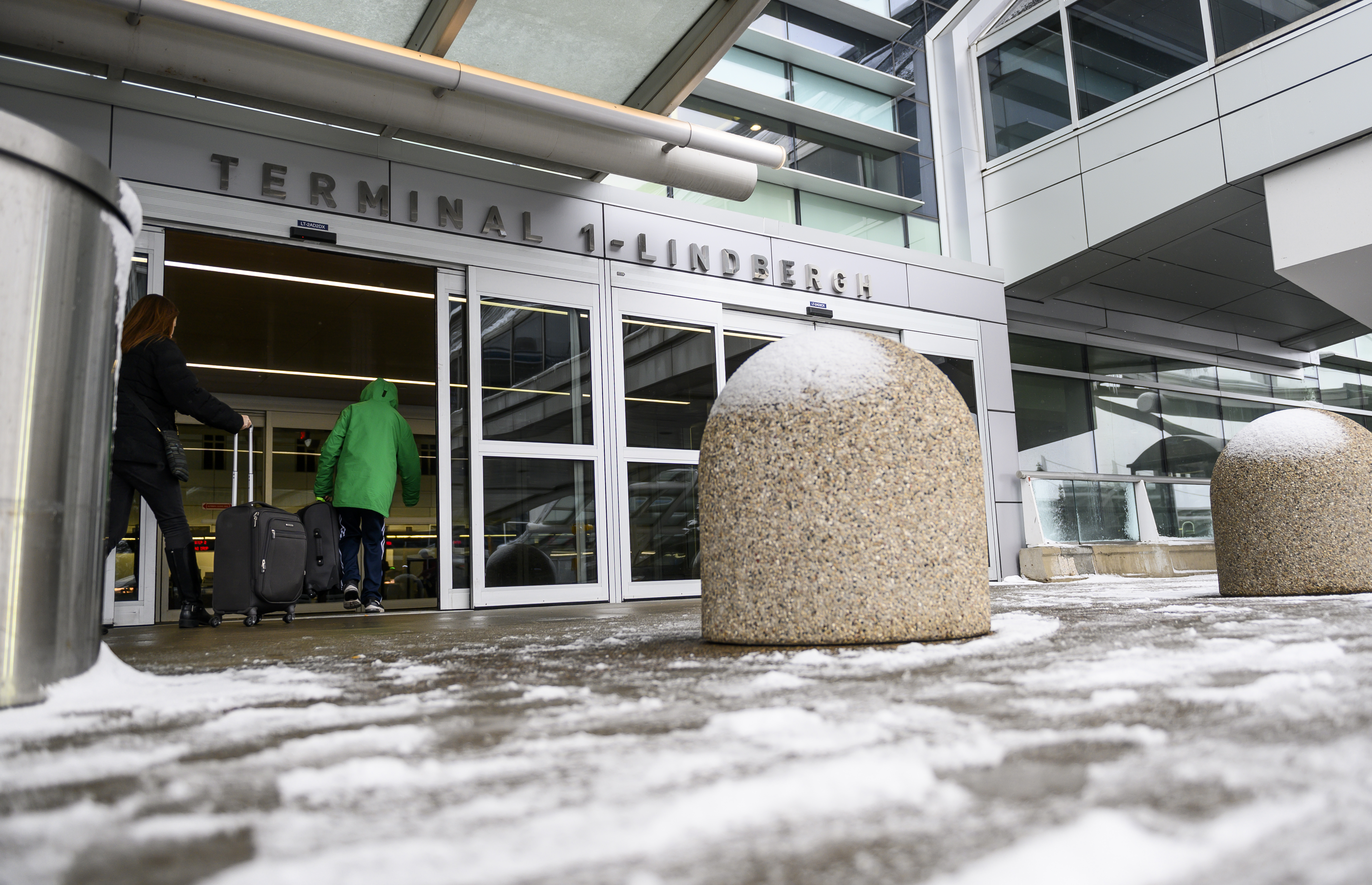 Travelers arrive at Minneapolis-St. Paul International Airport on Wednesday.