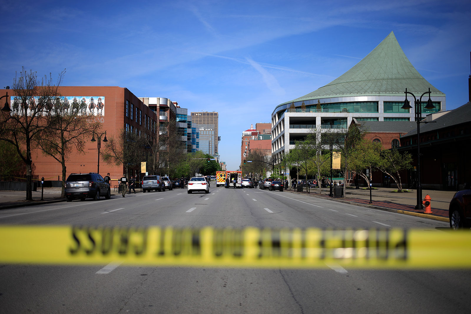 Emergency personnel respond to a shooting in downtown Louisville on Monday.