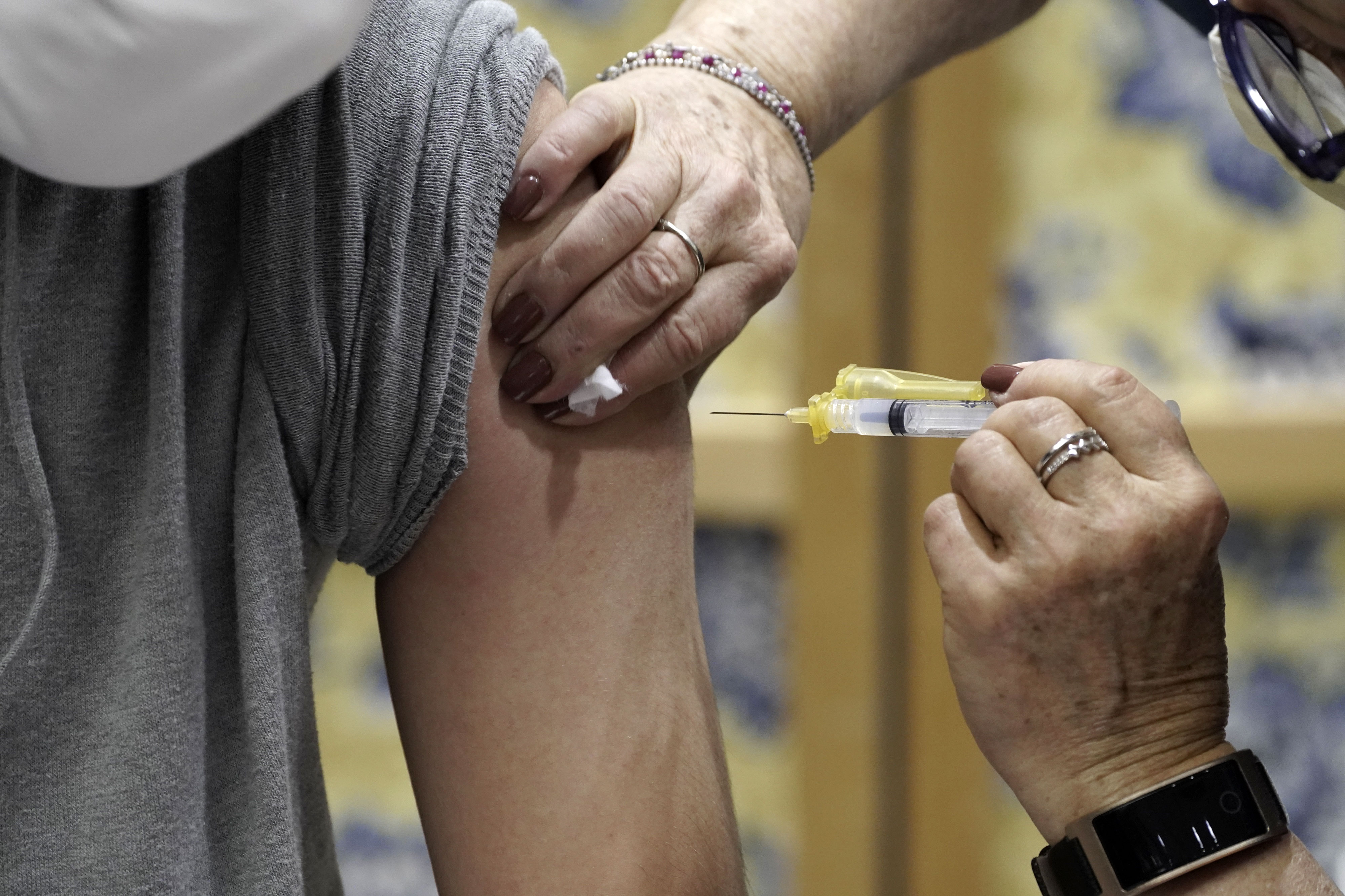 A person receives the Moderna Covid-19 vaccine in Tucson, Arizona, on January 15.