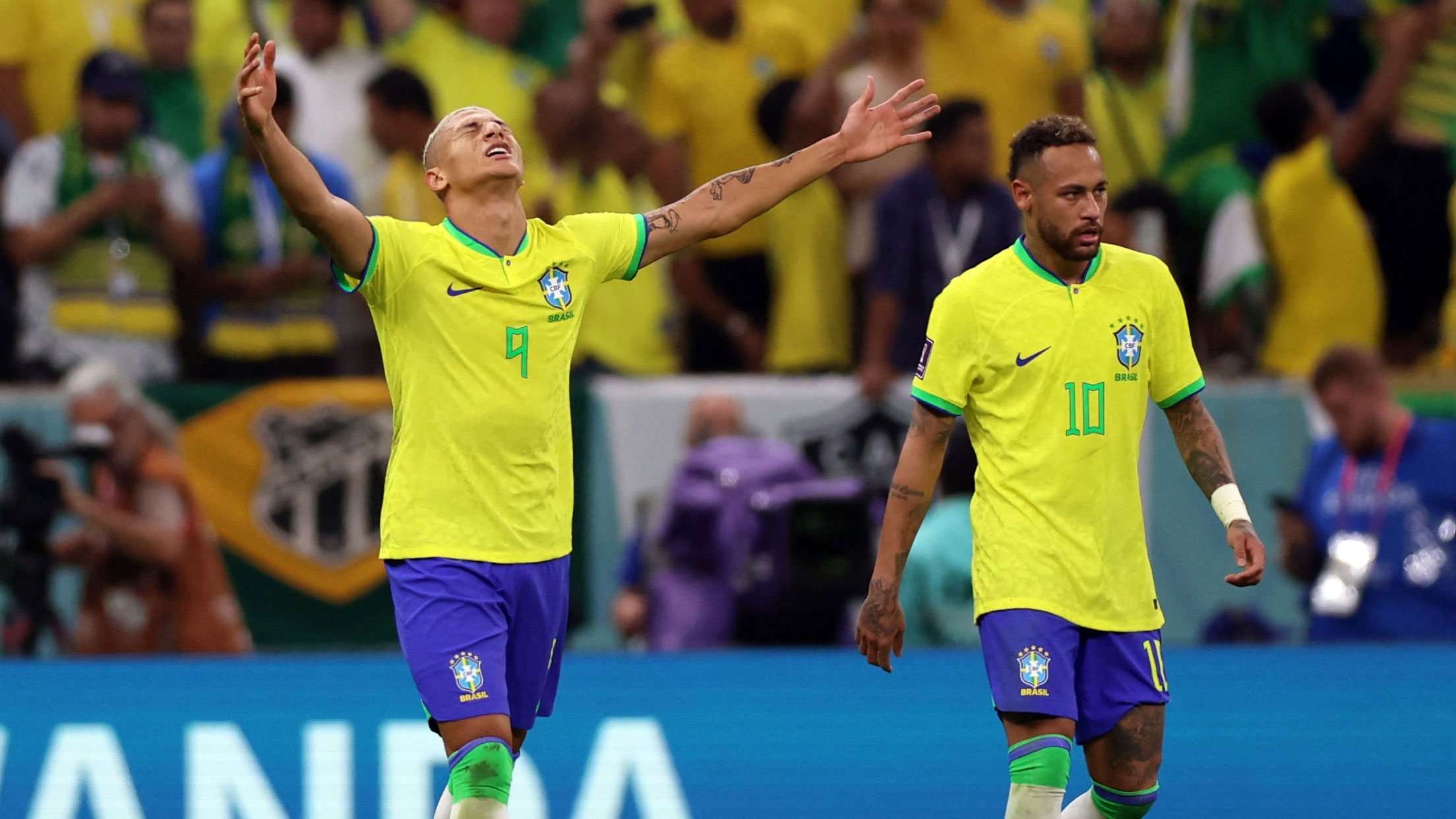 Richarlison celebrates his opening goal next to Neymar.