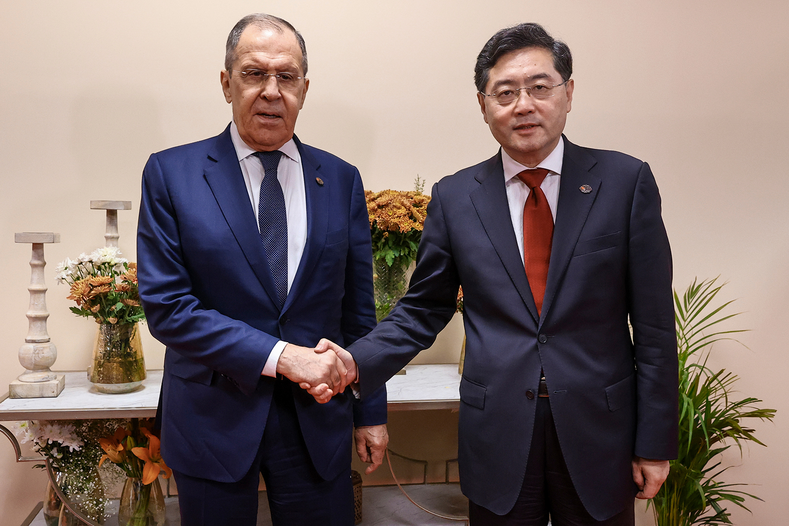 Russian Foreign Minister Sergey Lavrov, left, and Chinese Foreign Minister Qin Gang pose for photo on the sideline of G20 foreign minister's meeting in New Delhi, India, on Thursday, March 2.