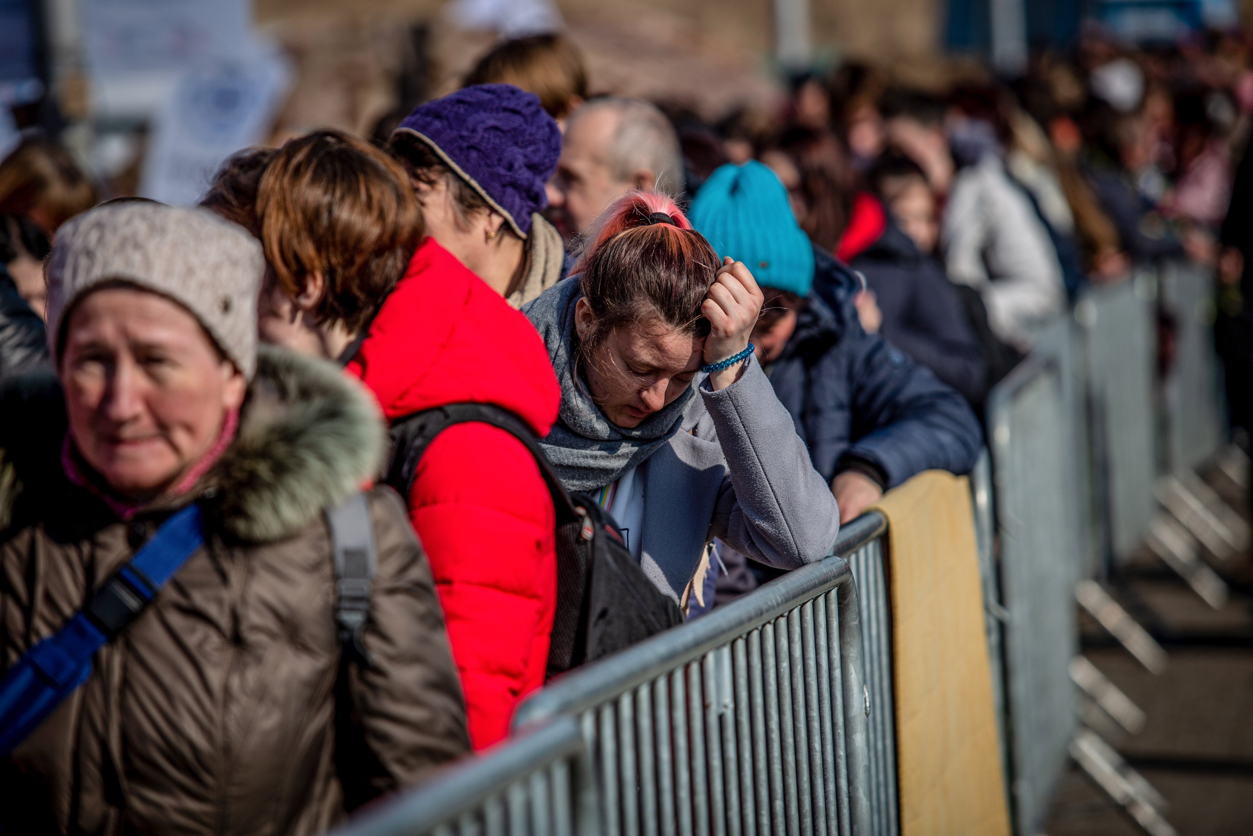 Displaced Ukrainians wait in line at the Medyka border crossing in Medyka, Poland, on March 15. 
