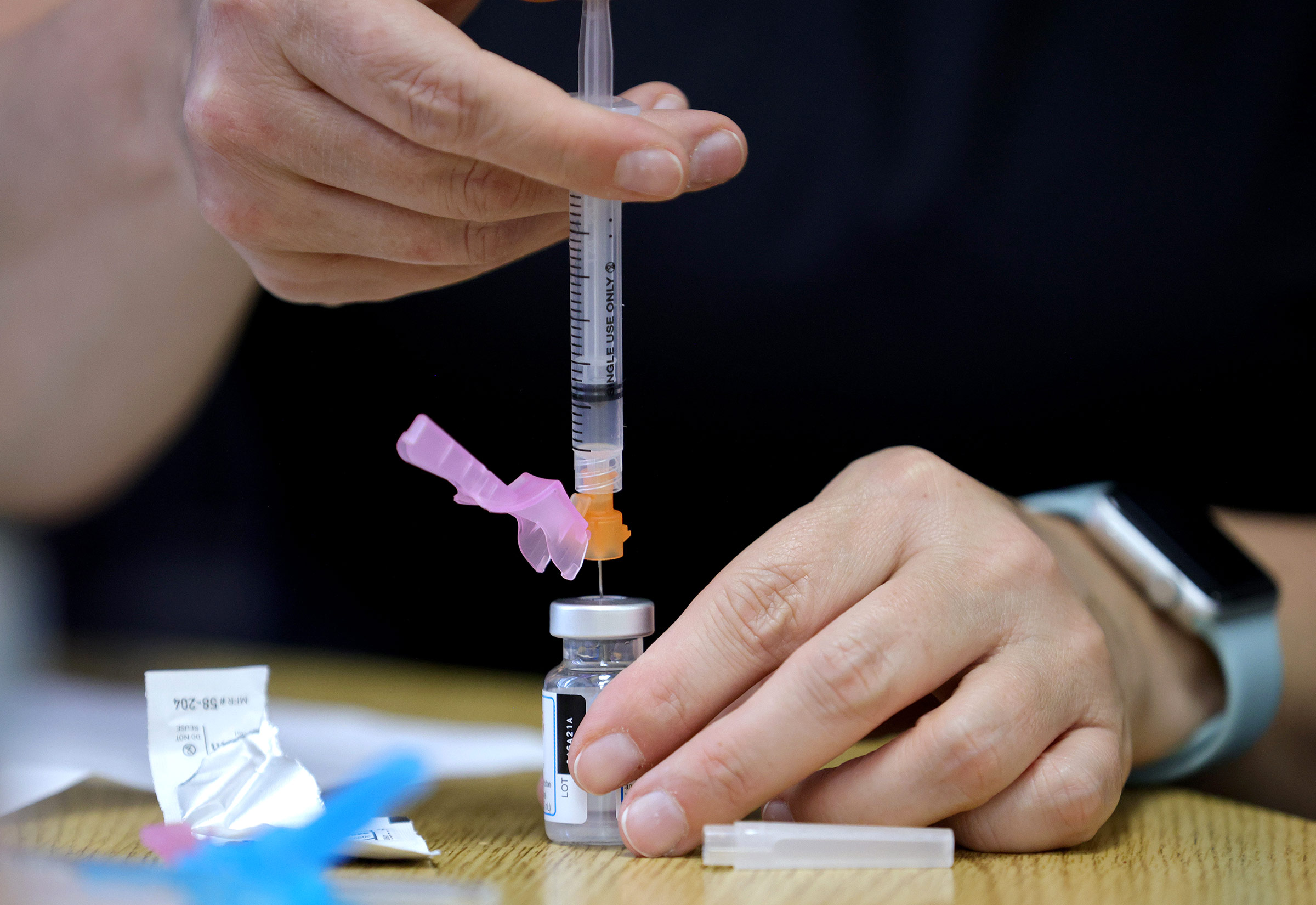 A dose of the Moderna Covid-19 vaccine is prepared in Severn, Maryland, on March 23. 