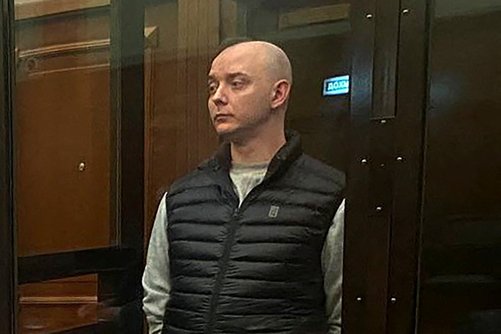 Ivan Safronov, a former journalist and adviser to the head of Russian space agency Roscosmos accused of state treason, stands inside a defendants' cage as he attends a court hearing in Moscow, Russia September 5.