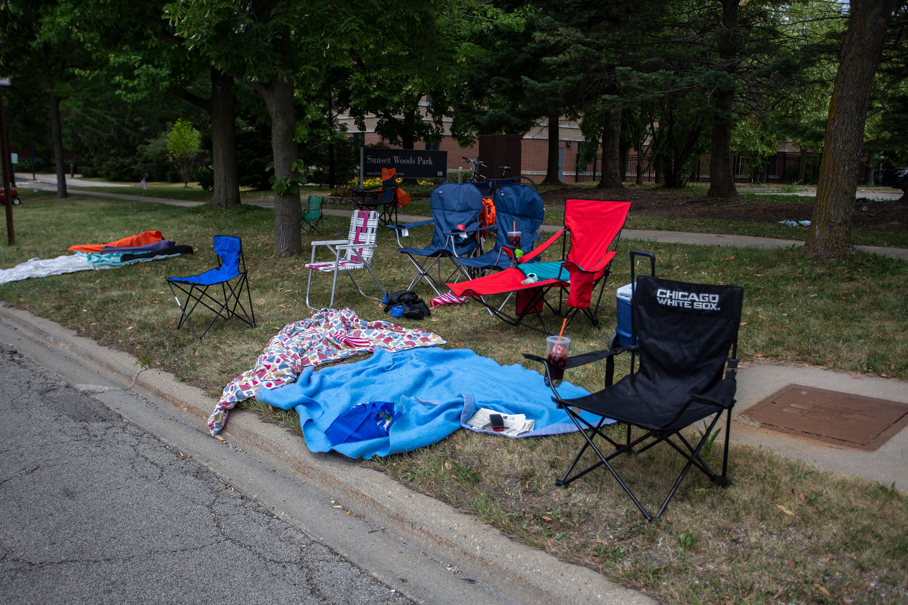 Chairs and blankets are left abandoned after the shooting in Highland Park, Illinois, on Monday.