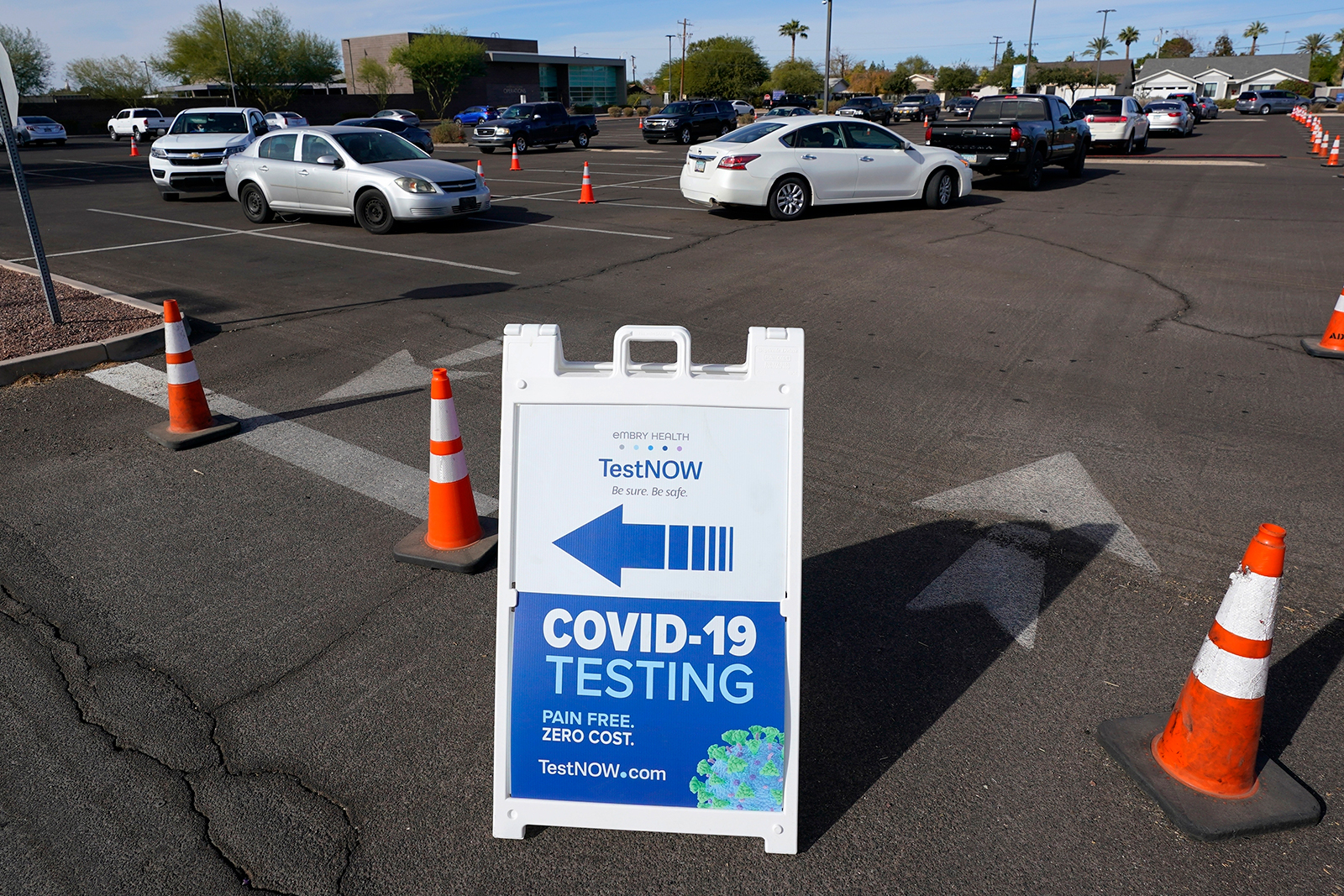 Vehicles line up as patrons wait for Covid-19 tests at a drive-thru testing center in Phoenix on Dec. 8, 2020.