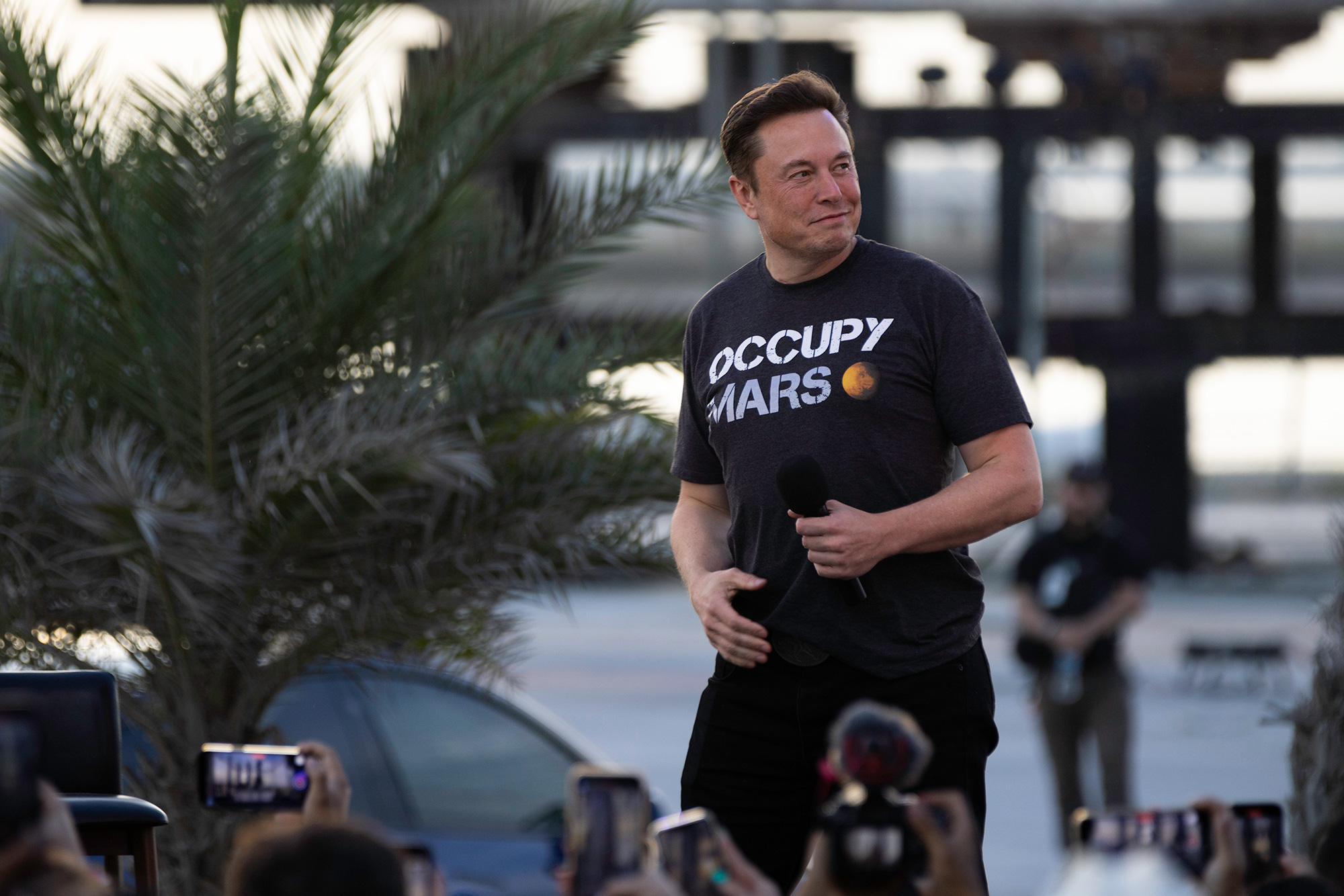 Elon Musk walks on stage during a T-Mobile and SpaceX joint event  in Boca Chica Beach, Texas, on August 25, 2022.