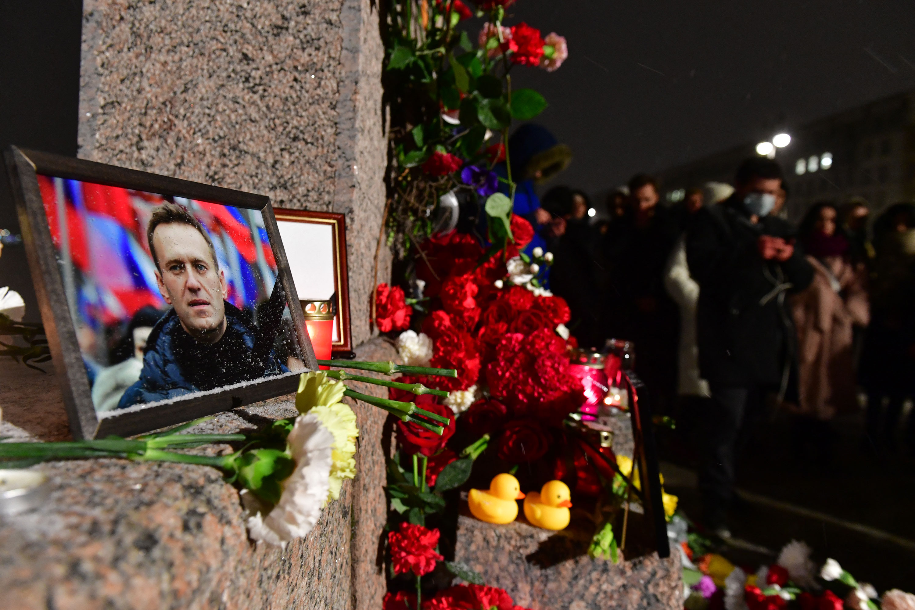 People gather at a makeshift memorial for Alexey Navalny in St. Petersburg, Russia, on February 16. 
