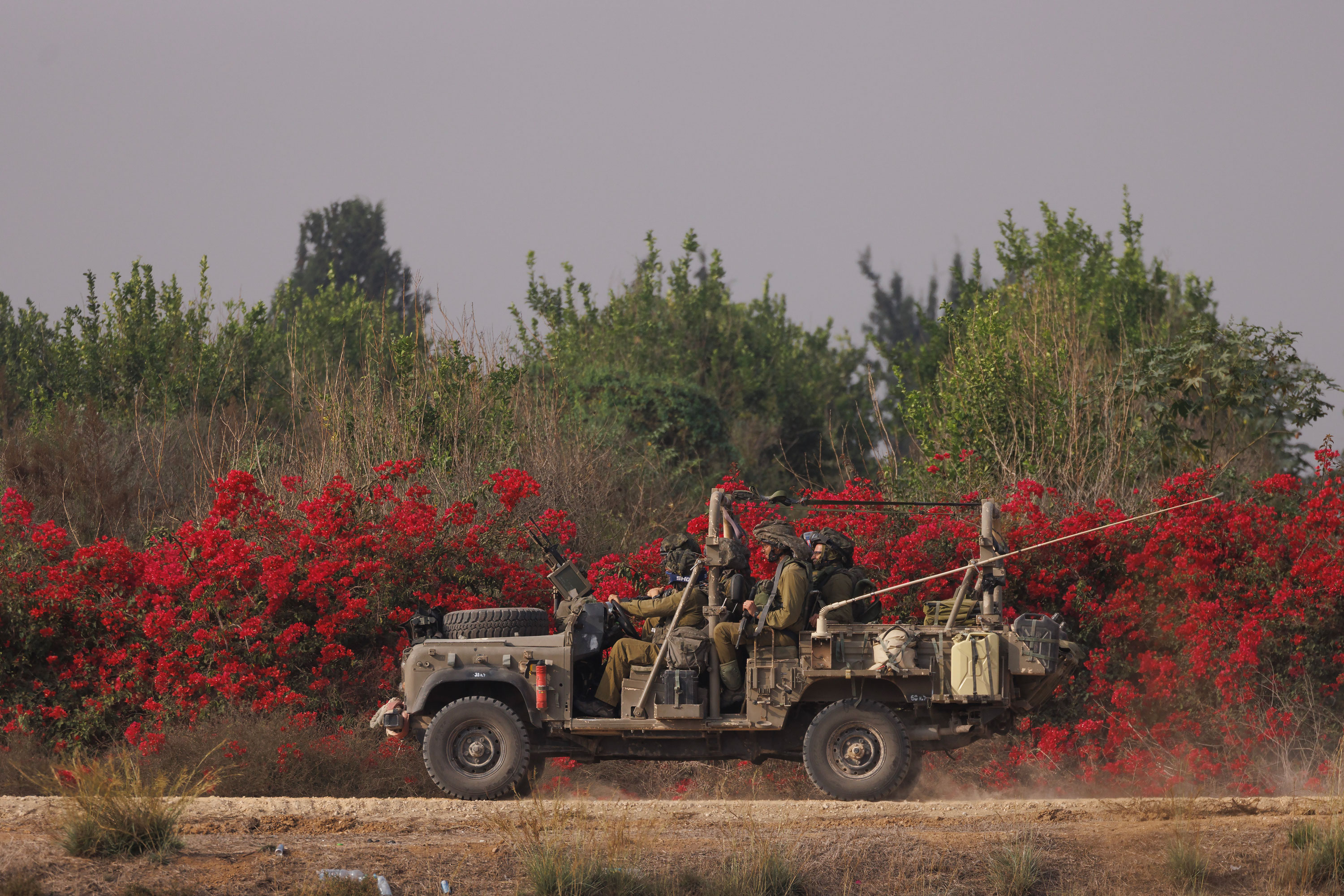 Israeli troops move near the border with Gaza on October 28 in Sderot, Israel.