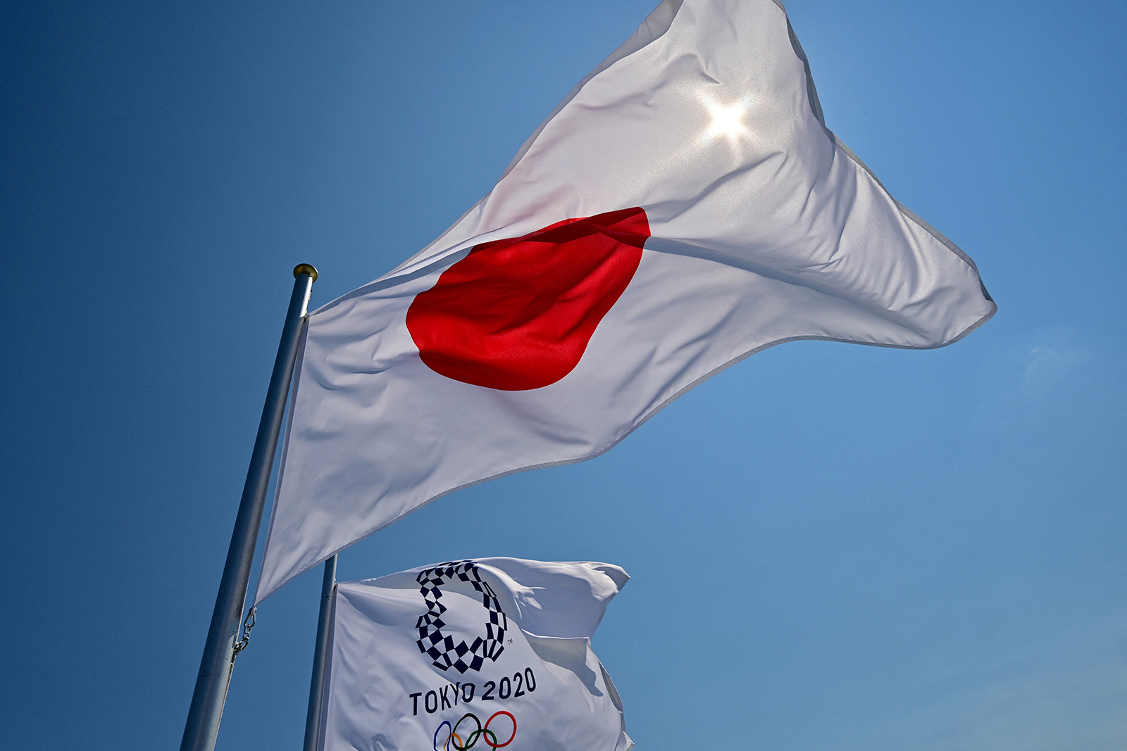 Japanese and Tokyo 2020 Olympic flags wave at the Aomi Urban Sports Park ahead of the Olympic Games in Tokyo on July 22.