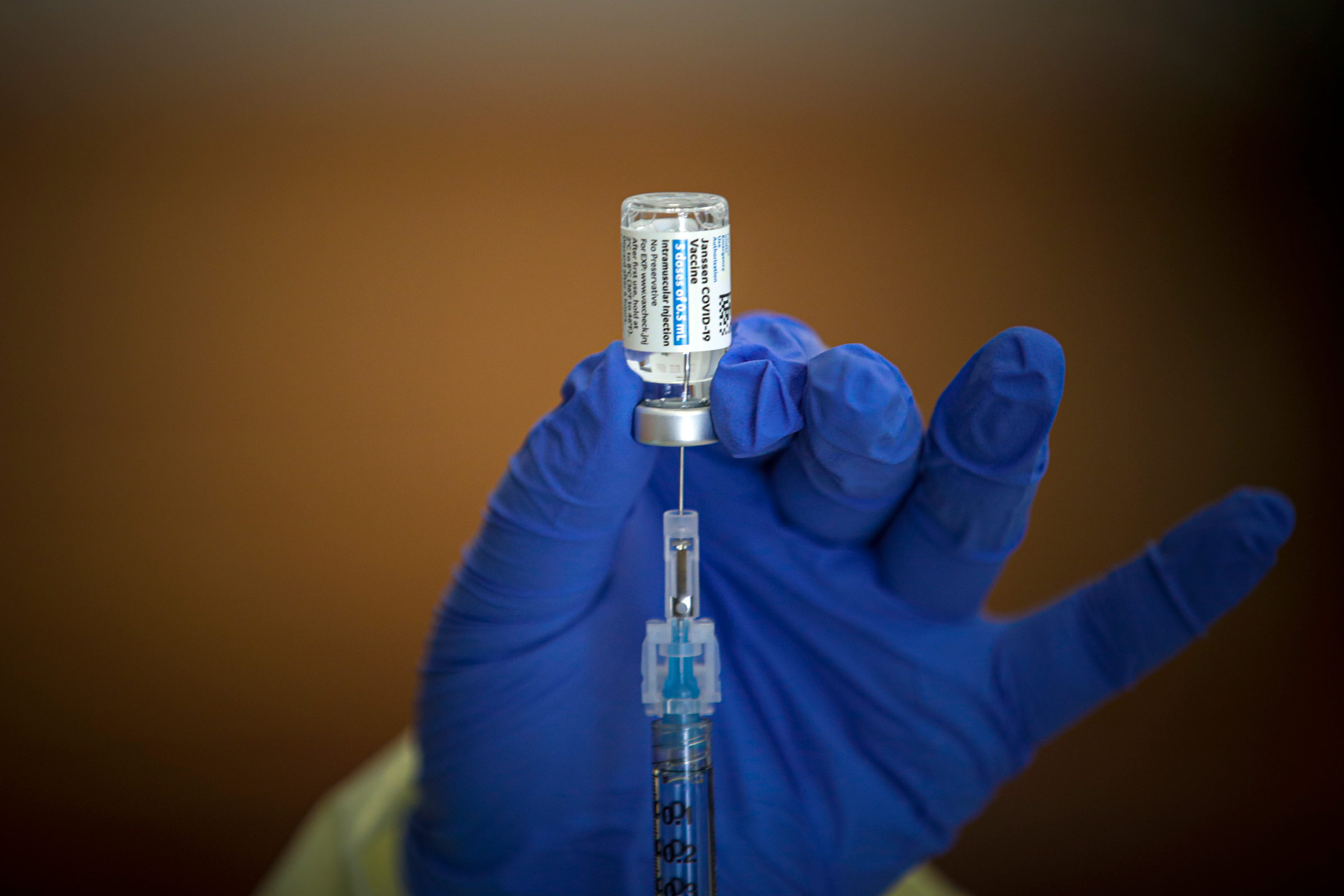 A Johnson & Johnson Covid-19 vaccine is prepared at a vaccination clinic in Lakewood, CA, on March 31.
