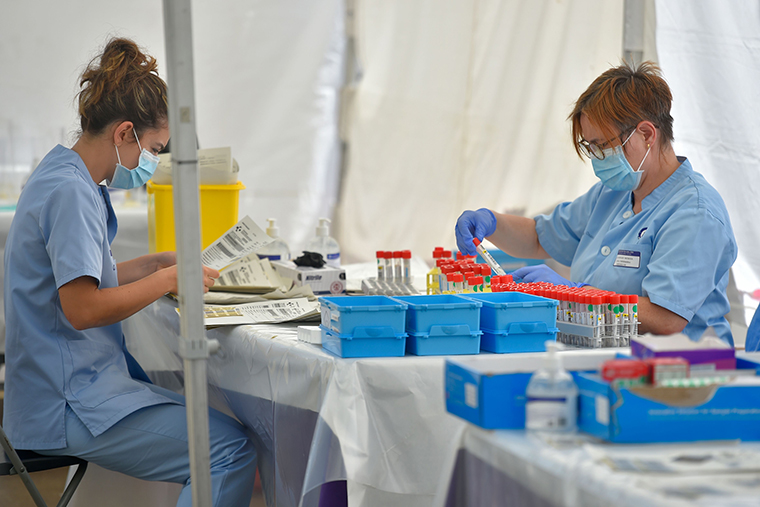 Healthcare workers gather samples collected at a temporary testing centre for the novel coronavirus in the Spanish Basque city of Ordizia on Wednesday, July 8. 