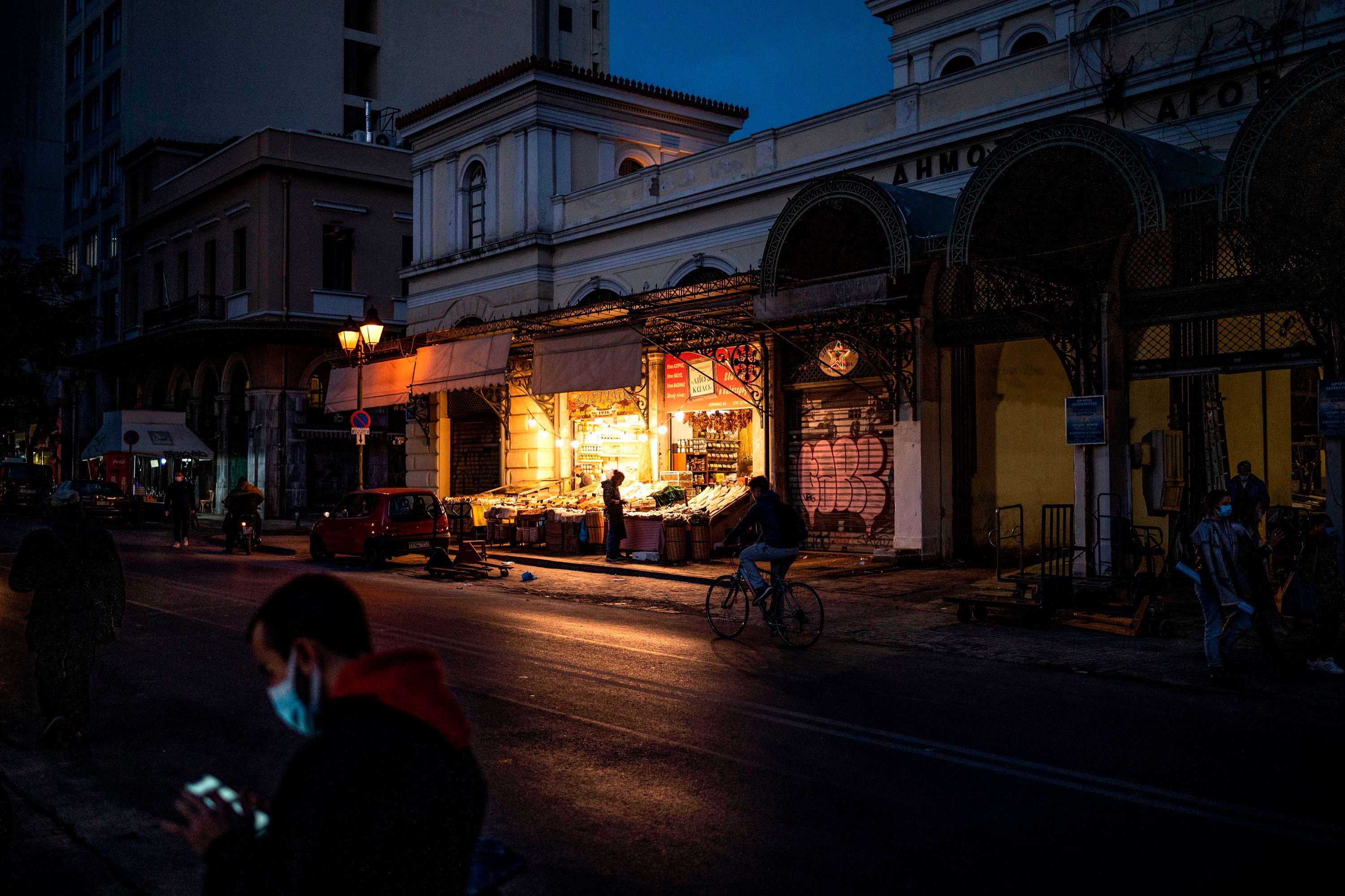People make their way past a meat market in Athens, Greece, on February 2.
