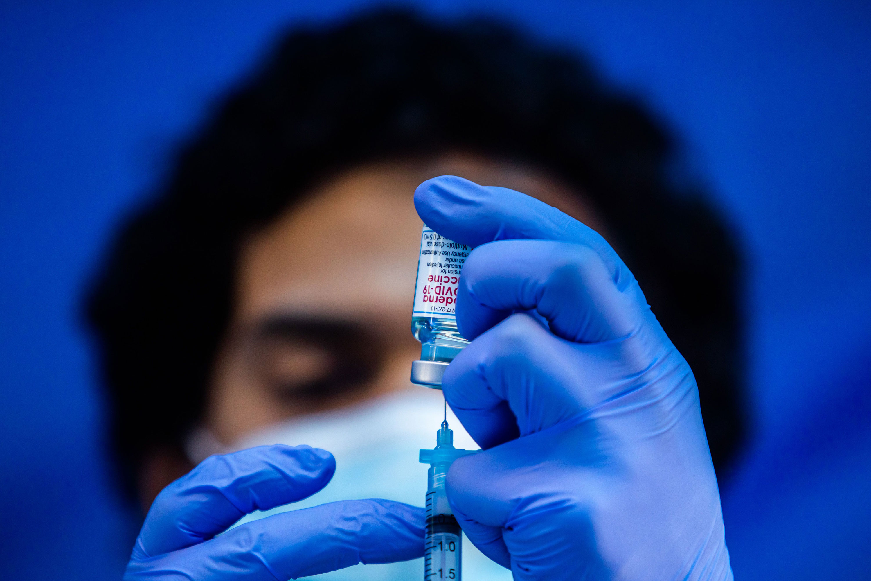 A medical worker loads a syringe with the Moderna Covid-19 vaccine at Kedren Community Health Center in Los Angeles on February 16.