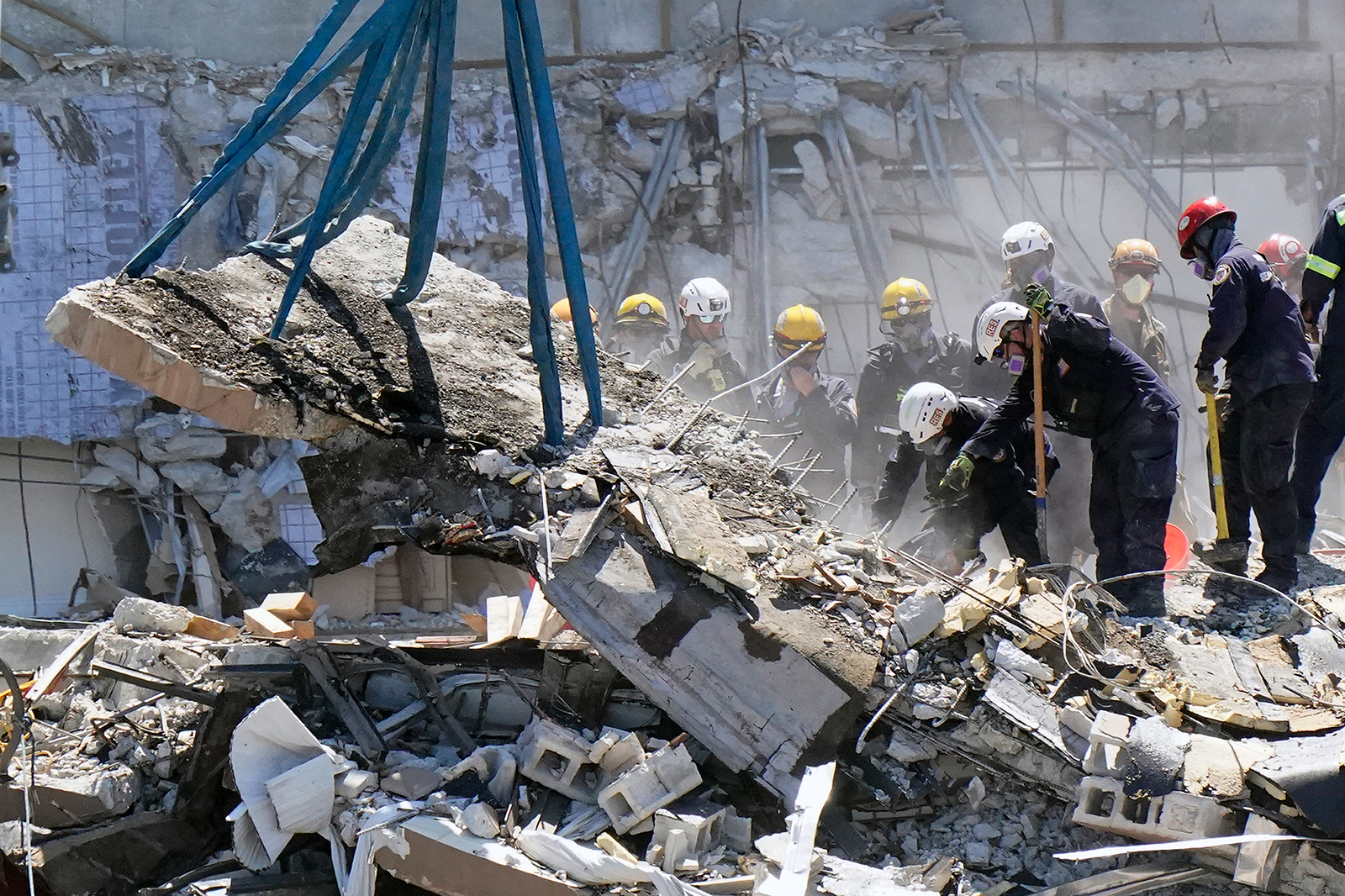 Crews work in the rubble at the Champlain Towers South Condo, Sunday, June 27, in Surfside, Florida.