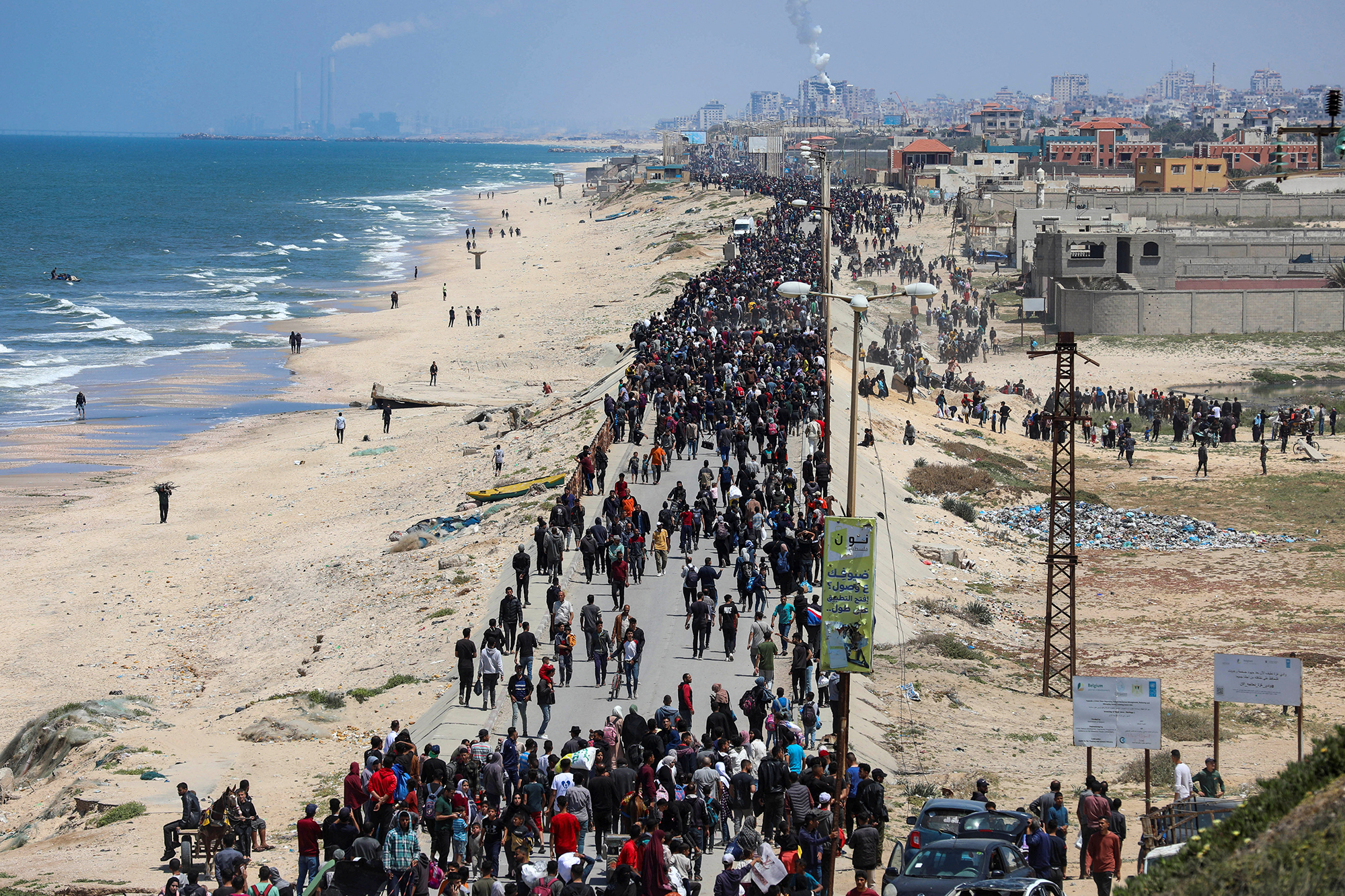 Displaced Palestinians make their way north as they attempt to return to their homes in northern Gaza on April 14.