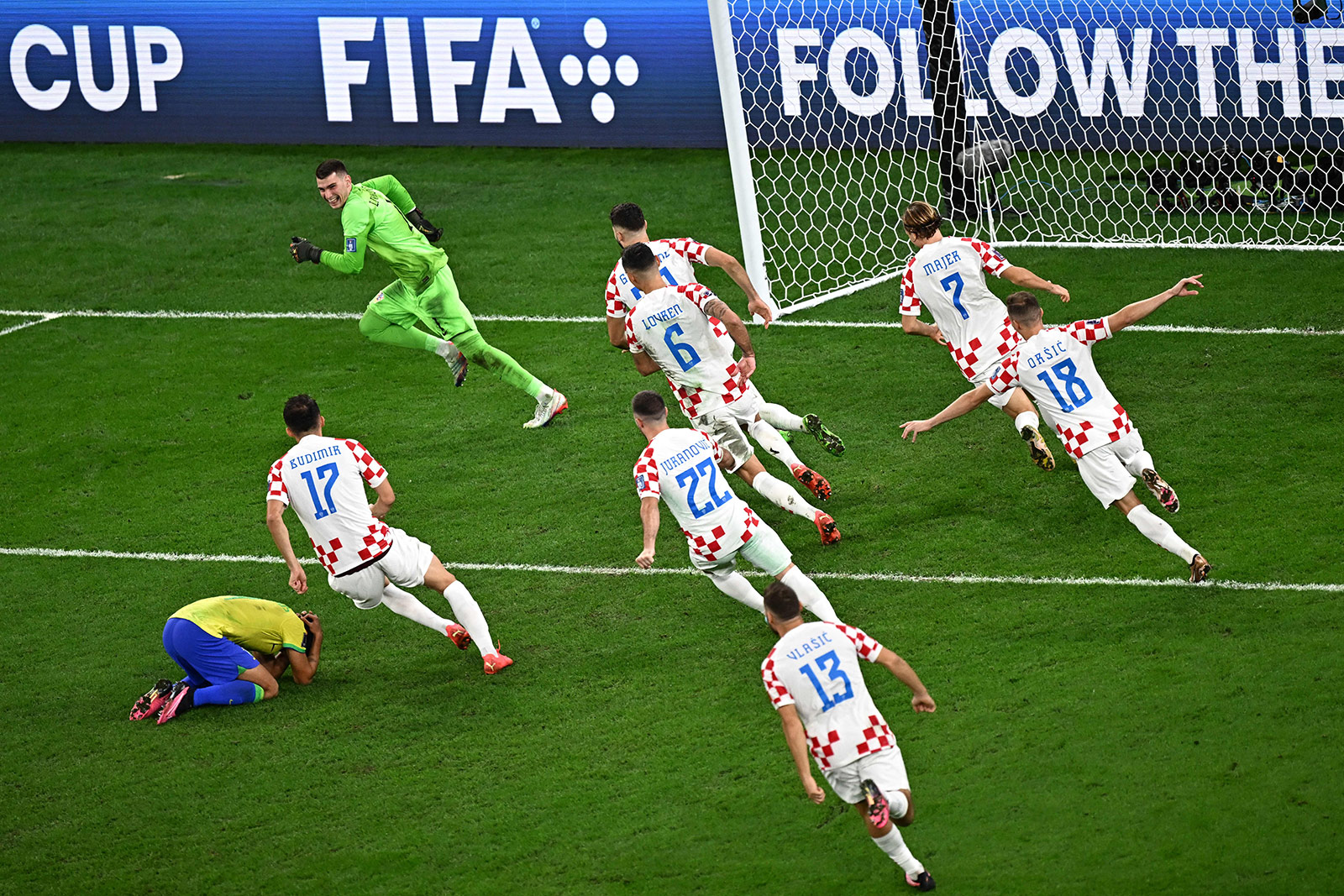 Croatia's players celebrate their win against Brazil on December 9.