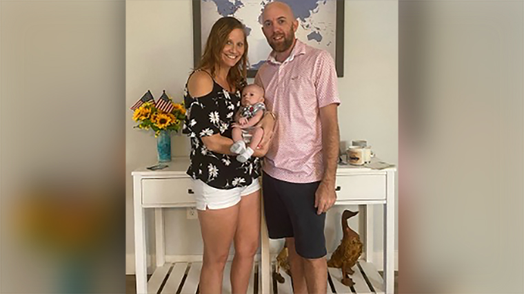 Callie Brown and Chad Duckwall pose with their baby Charlie.