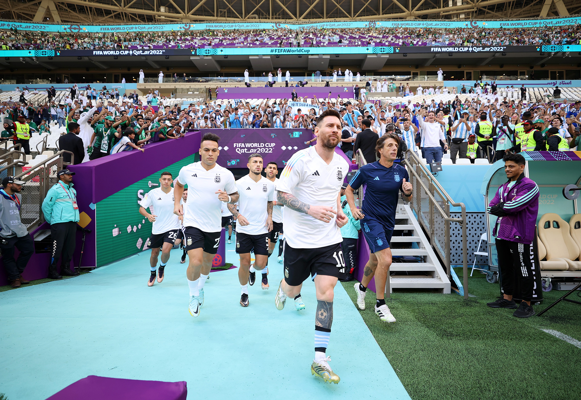 Lionel Messi of Argentina leads the team onto the pitch for warm ups prior to the FIFA World Cup Qatar 2022 Group C match between Argentina and Saudi Arabia at Lusail Stadium on November 22.