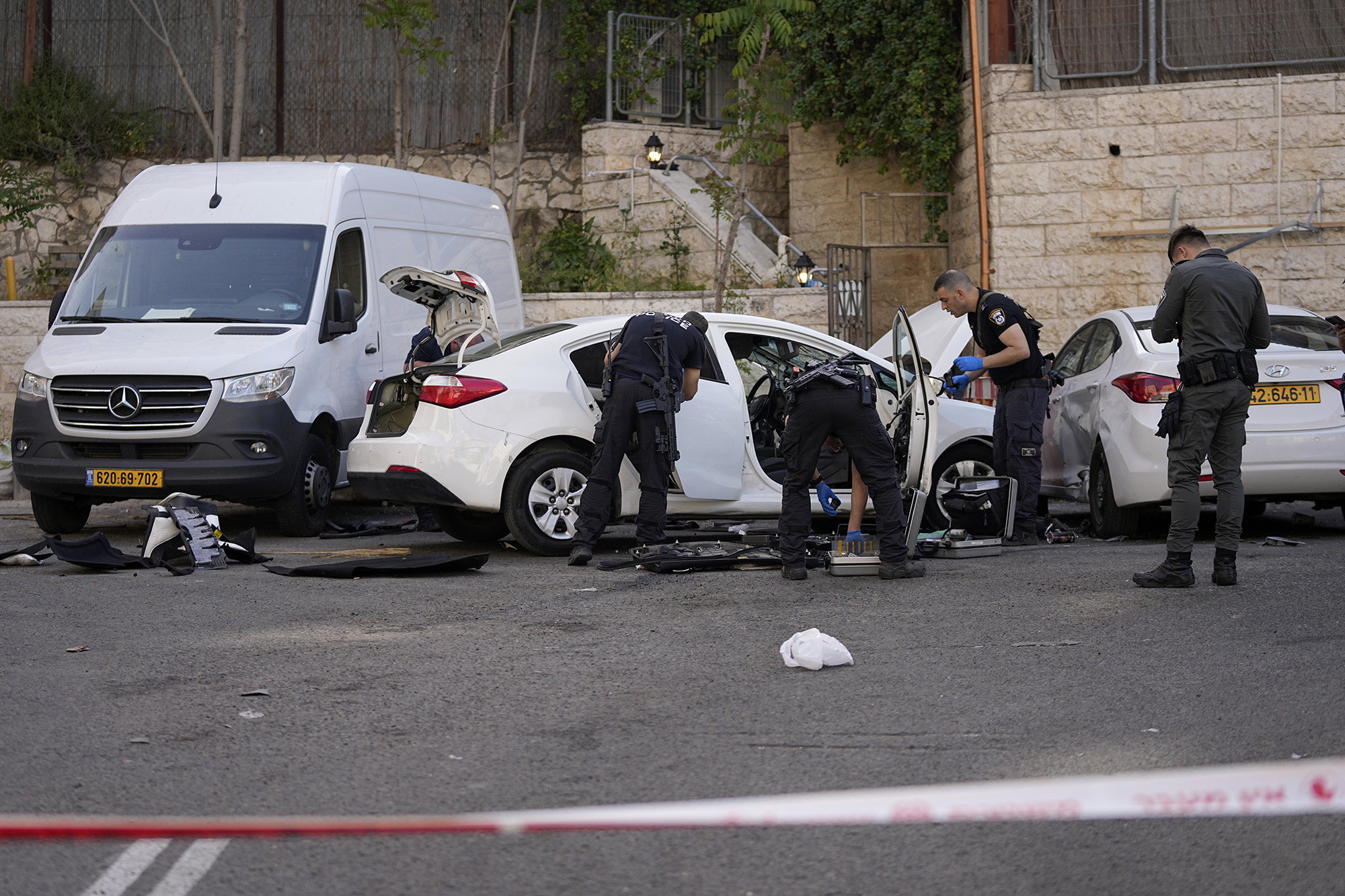 Israeli police investigate the scene of a suspected ramming attack that wounded three people in Jerusalem, on April 22.
