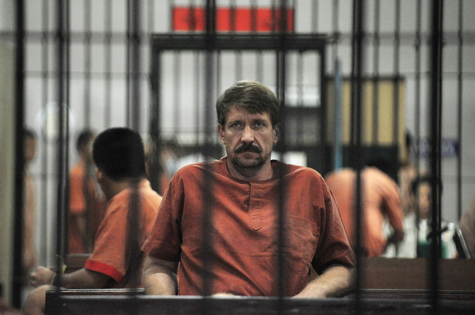 Alleged Russian arms dealer Viktor Bout sits in a temporary cell ahead of a hearing at the Criminal Court in Bangkok, Thailand, on August 20, 2010.