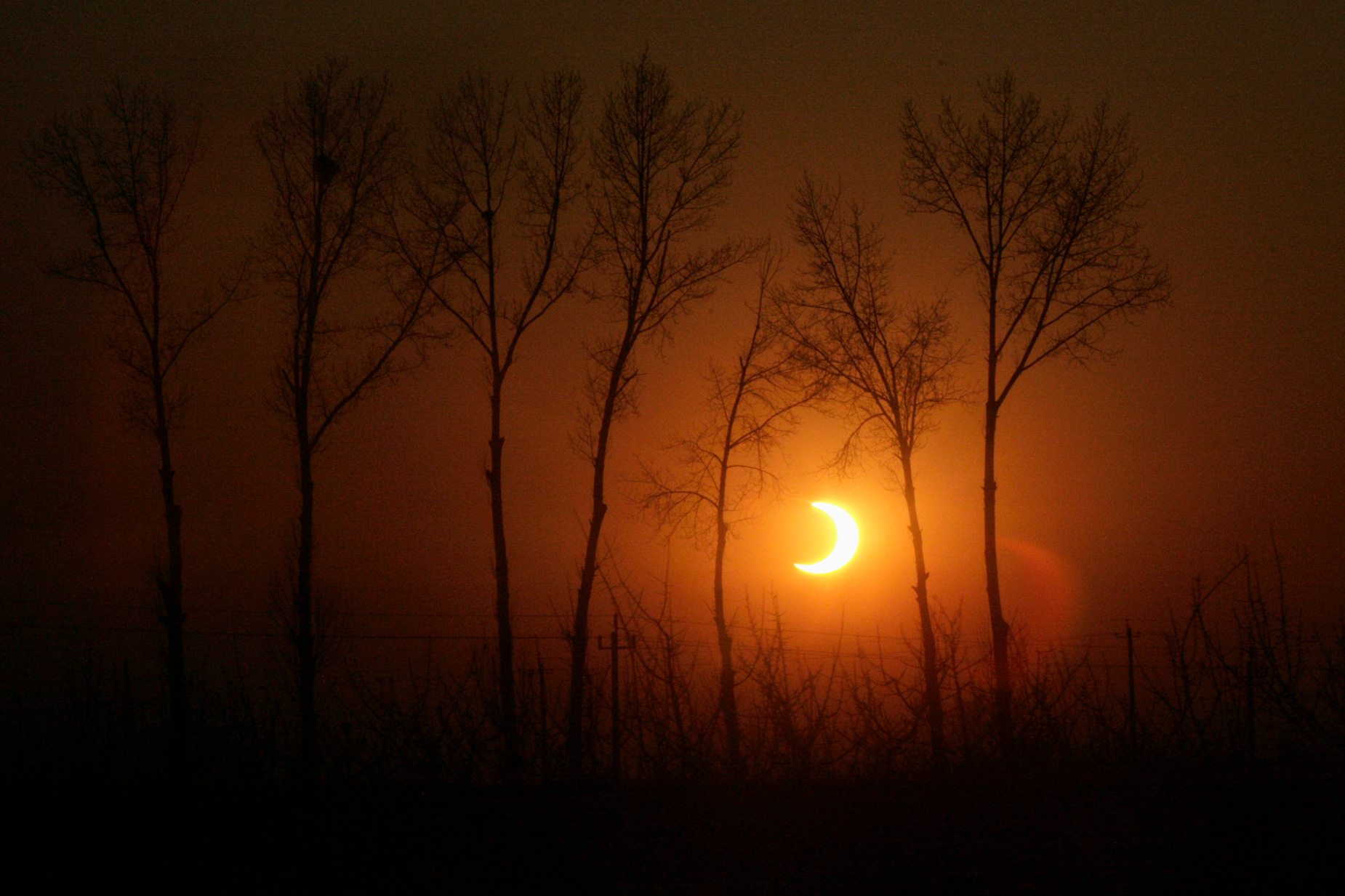 The sun is eclipsed by the moon during an annular solar eclipse on the outskirts of Beijing in January, 2010.