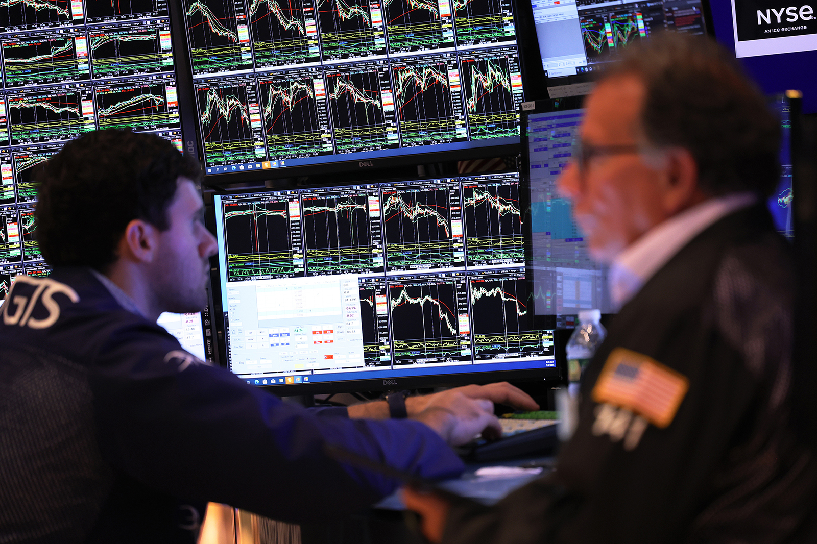 Traders work on the floor of the New York Stock Exchange during morning trading on July 6.