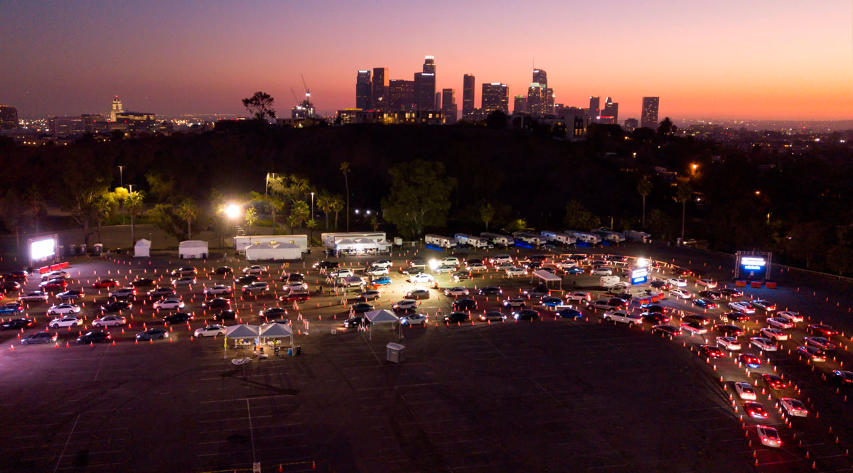 Cars line up at the Dodger Stadium parking lot for Covid-19 testing while the downtown Los Angeles skyline is seen in the distance, in Los Angeles, California, on November 14.