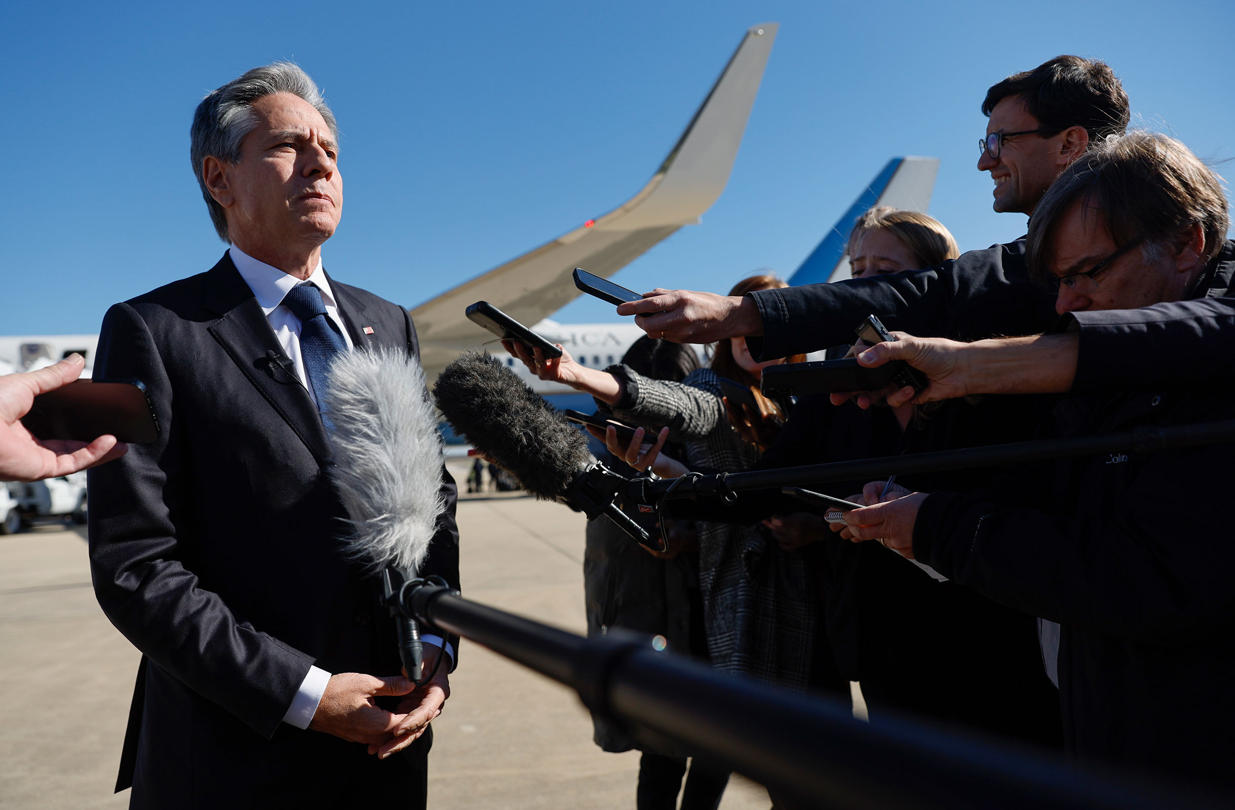 Secretary of State Antony Blinken talks to reporters prior boarding his aircraft to depart Washington on travel to the Middle East and Asia at Andrews Air Force Base in Maryland on Thursday.