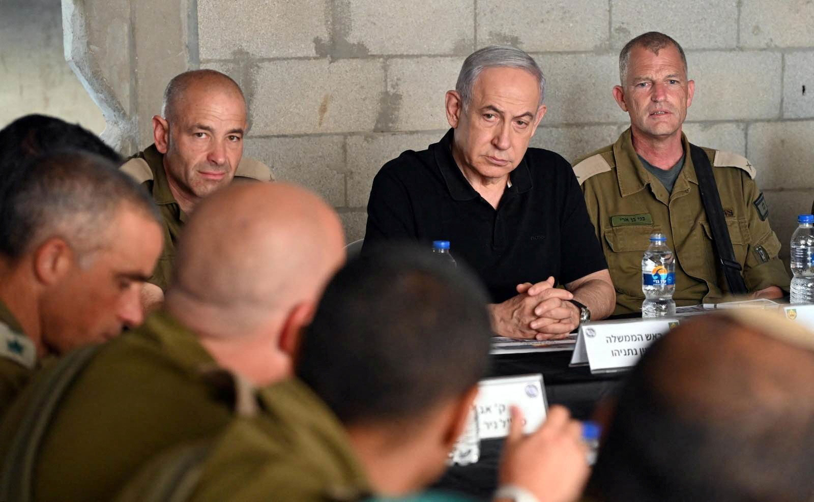 Israeli Prime Minister Benjamin Netanyahu meets with soldiers as he visits an army base in Tze'elim, Israel, on November 7. 
