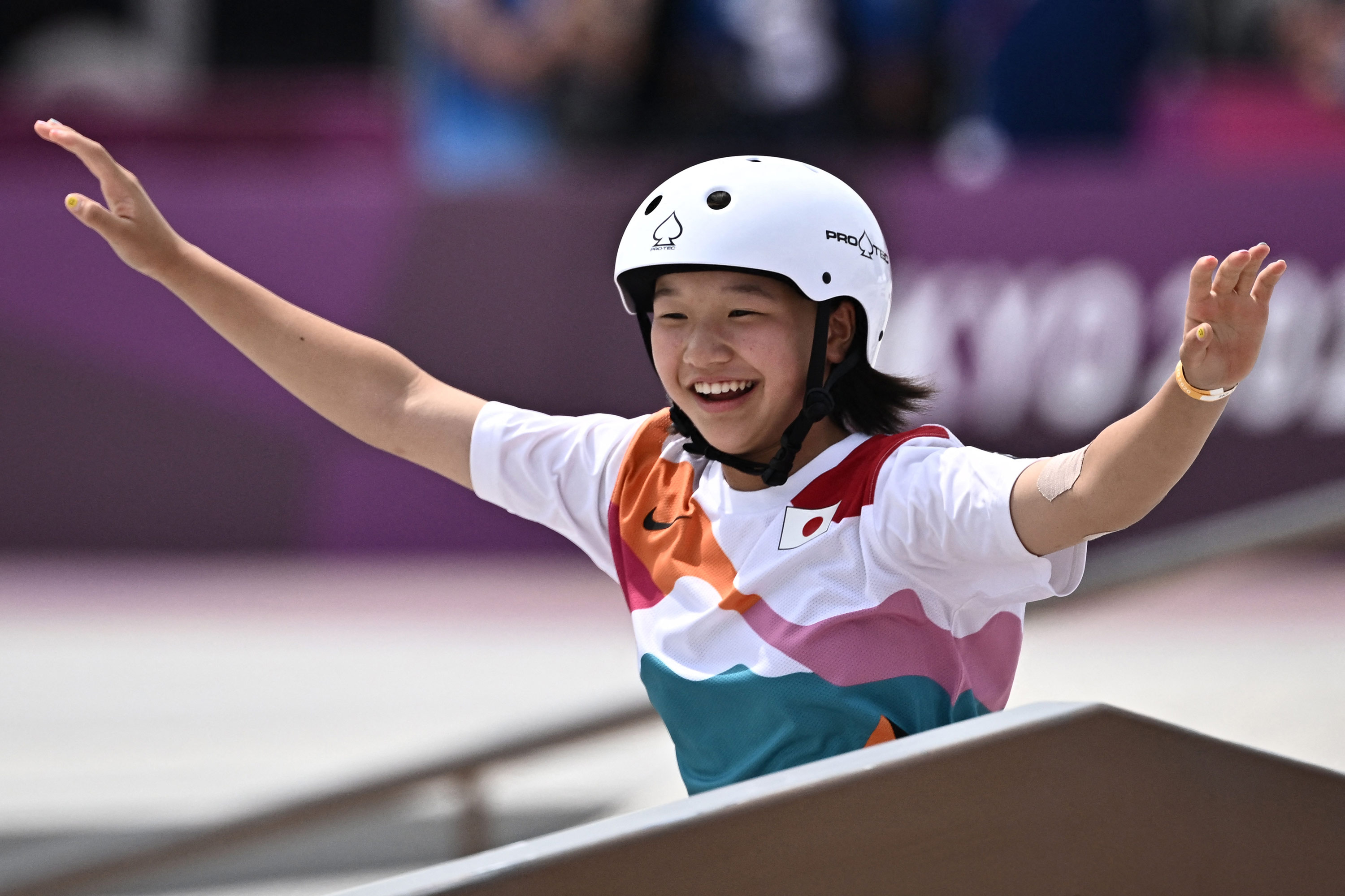 Japan's Nishiya Momiji celebrates after performing a trick during the skateboarding street final on July 26.