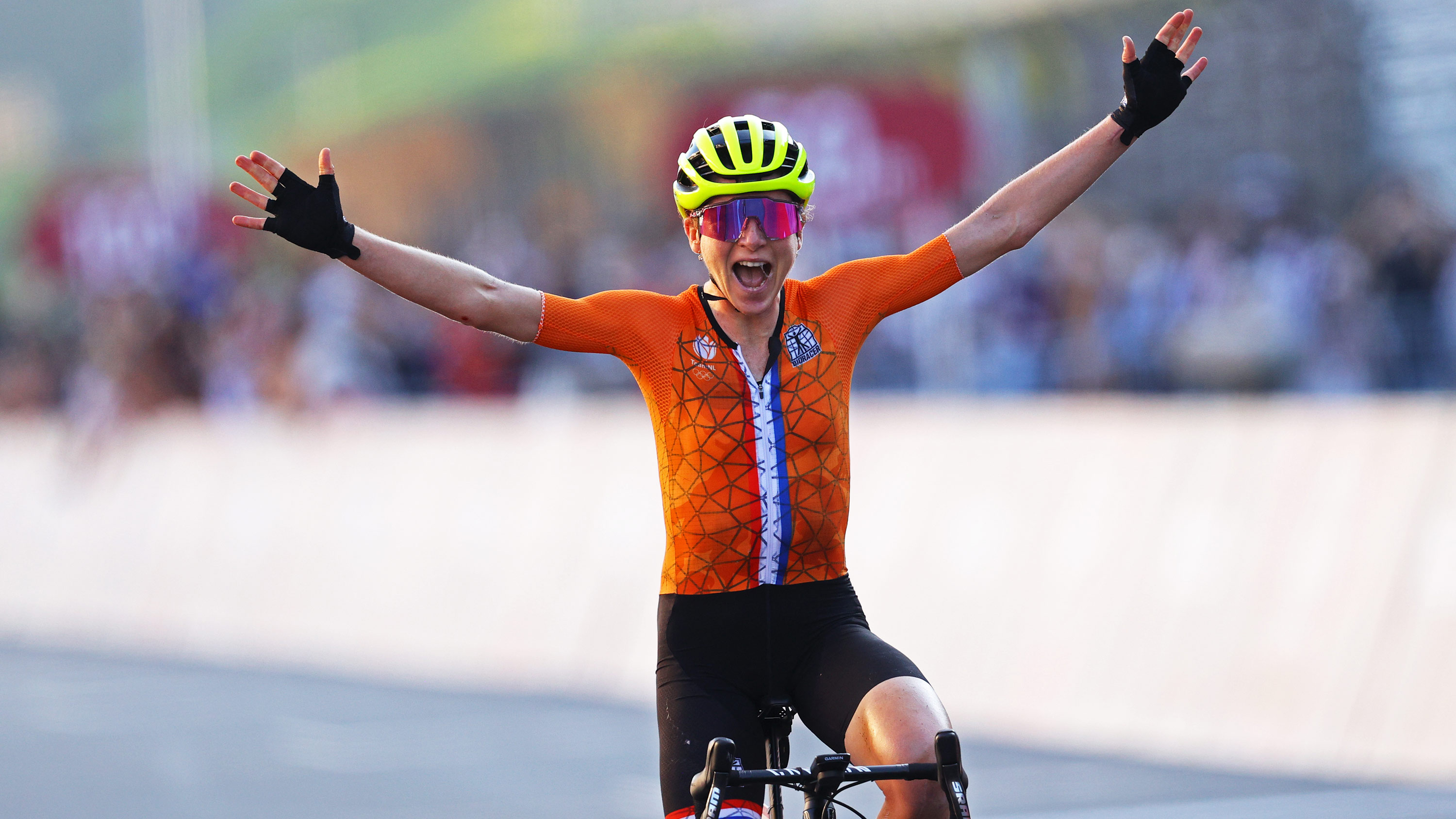 Annemiek van Vleuten of Team Netherlands celebrates while crossing the finishing line winning the silver medal in the road race on July 25.