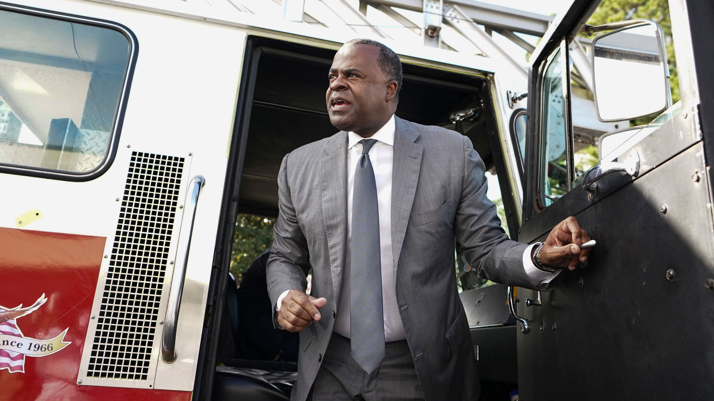 Former Atlanta Mayor Kasim Reed steps out of a fire truck after a news conference on October 7.