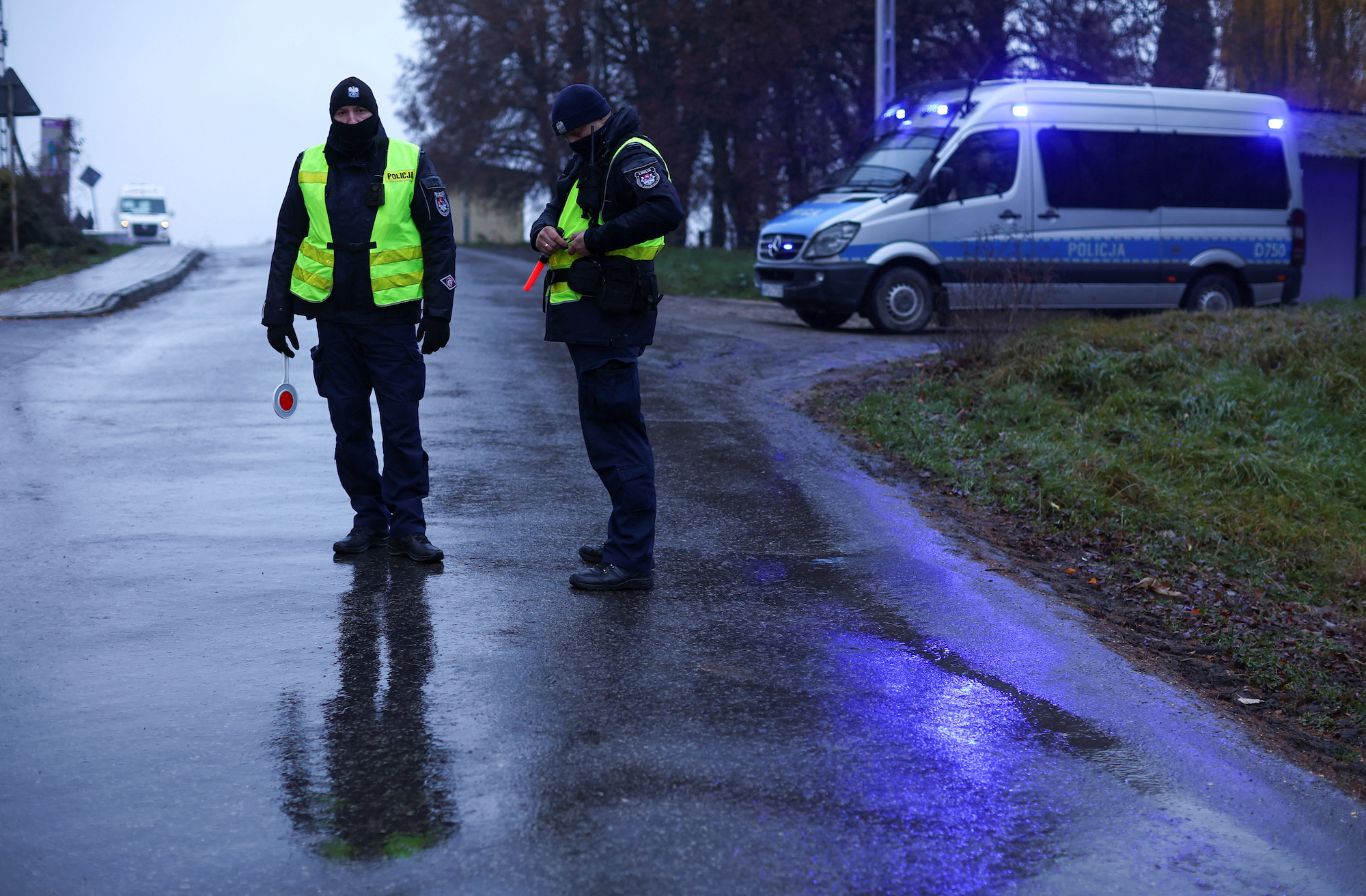 Police officers stand at a blockade near the explosion site in Przewodow on Wednesday.