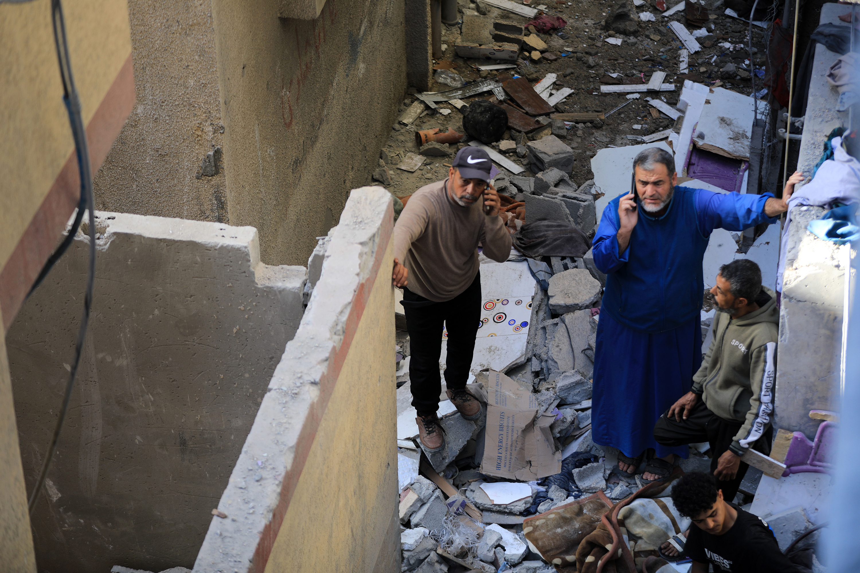 Palestinians inspect the destruction of a destroyed building following the Israeli attacks on Tel Al-Sultan neighborhood in Rafah, Gaza on April 20.