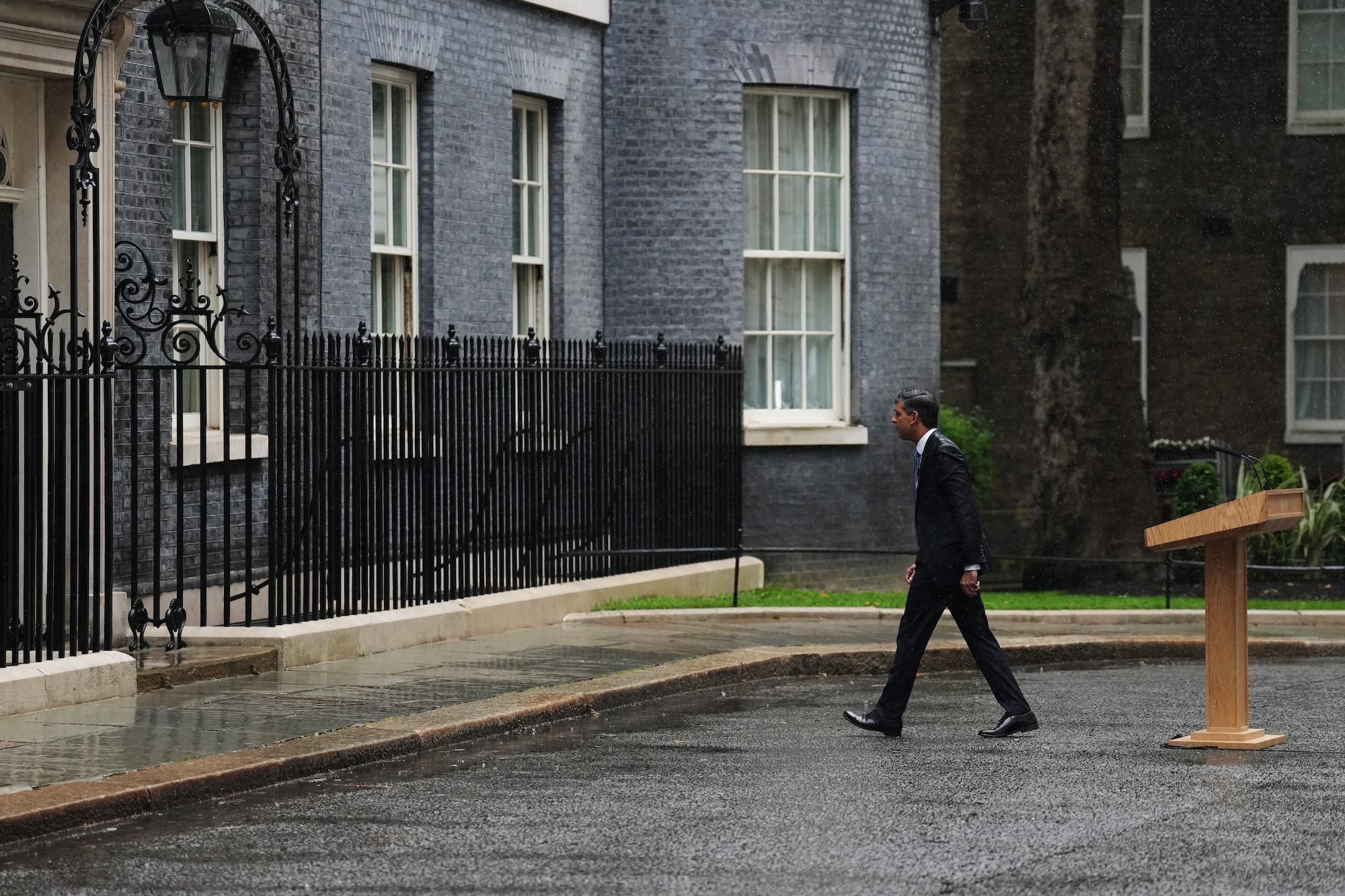 Prime Minister Rishi Sunak walks back into 10 Downing Street after announcing the date for the election.