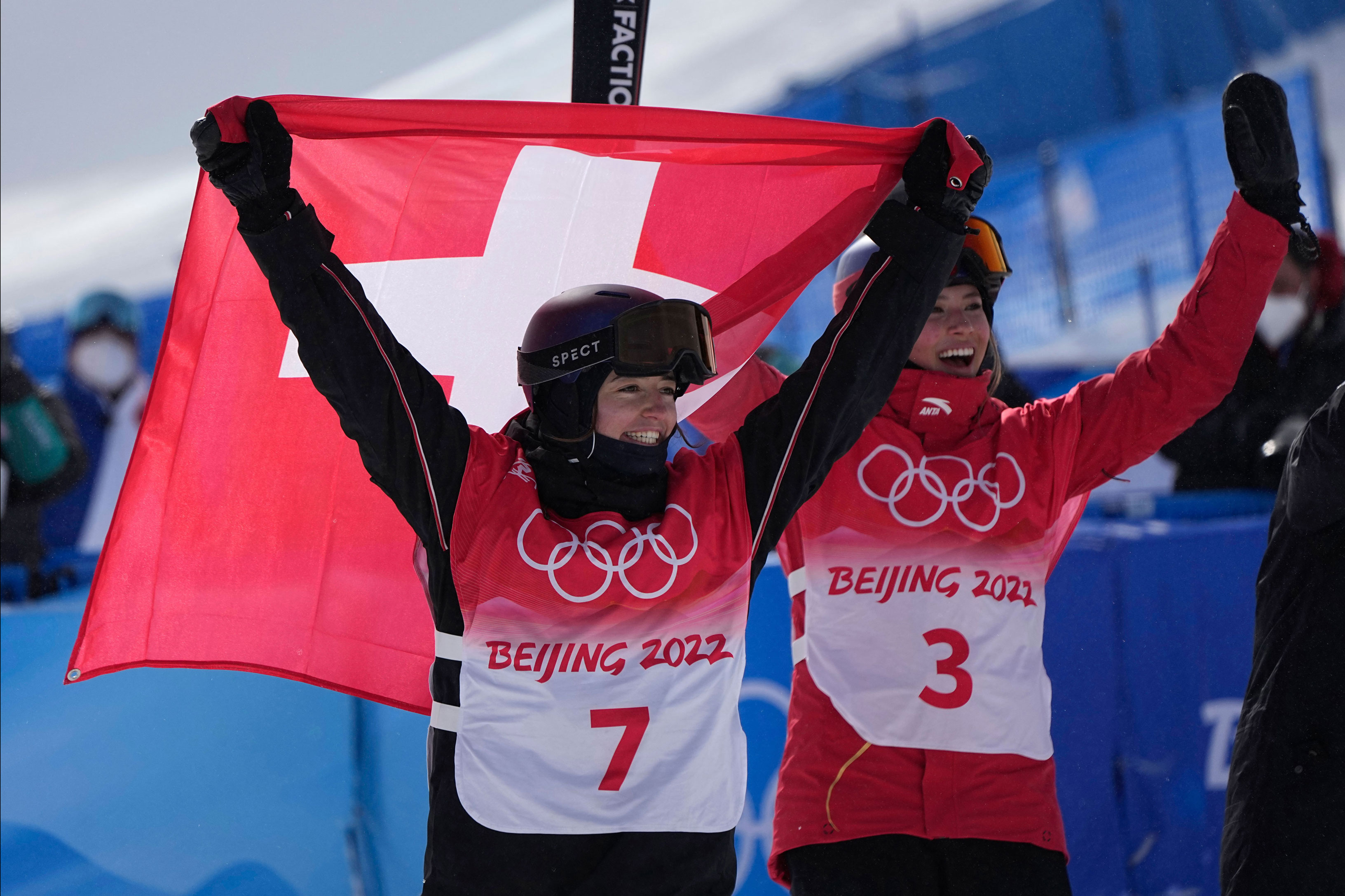 Mathilde Gremaud of Switzerland celebrates her gold medal win with silver medalist Eileen Gu of China, at the women's freeski slopestyle final on Tuesday.