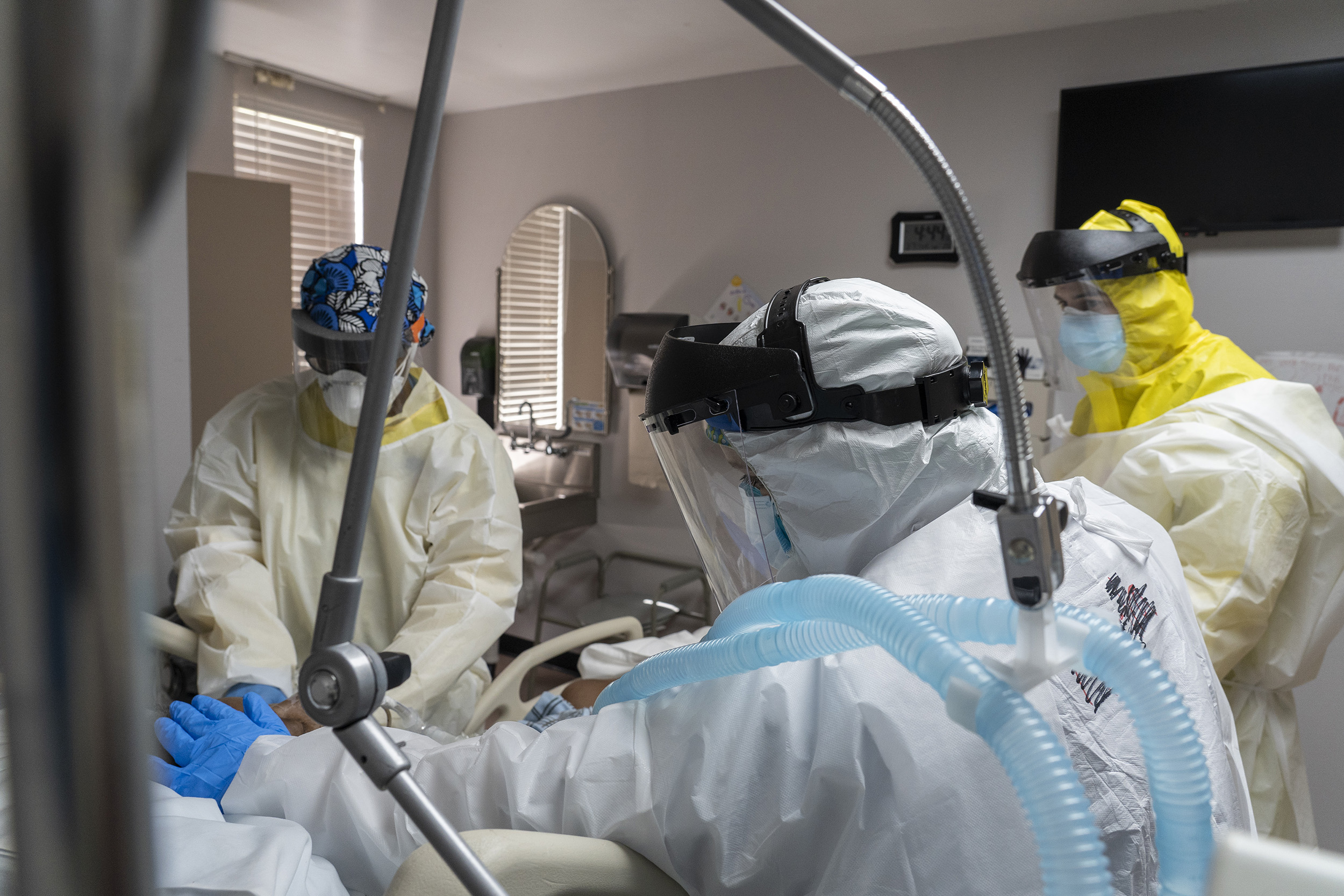 Members of the medical staff treat a patient in the COVID-19 intensive care unit at the United Memorial Medical Center on July 2, Houston, Texas.  