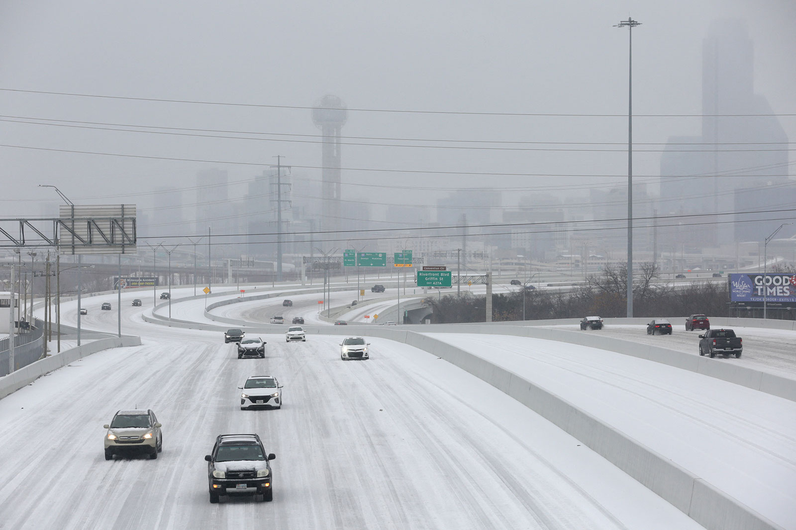 Cars drive down an icy highway as cold weather moves through Dallas on January 31. 