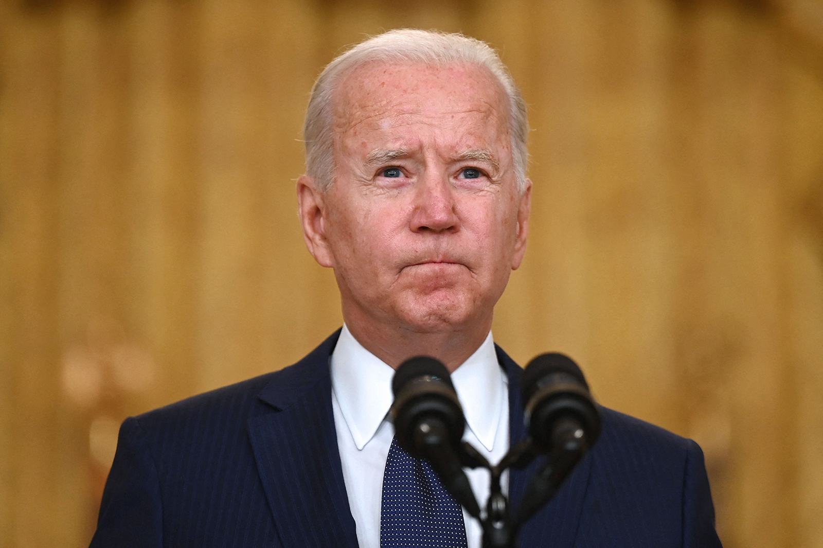 President Joe Biden delivers remarks on the terror attack at Hamid Karzai International Airport, and the US service members and Afghan victims killed and wounded, in the East Room of the White House in Washington on August 26.
