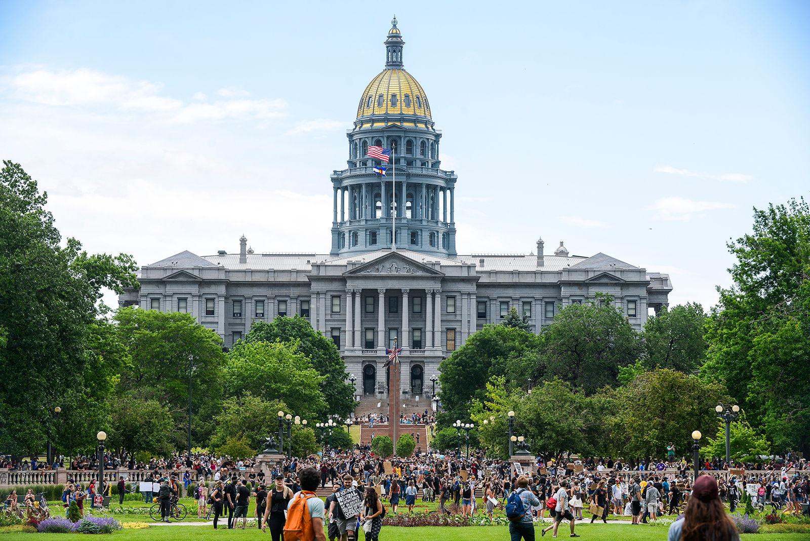 People protest in front of the Colorado State Capitol on Saturday, June 6, in Denver.