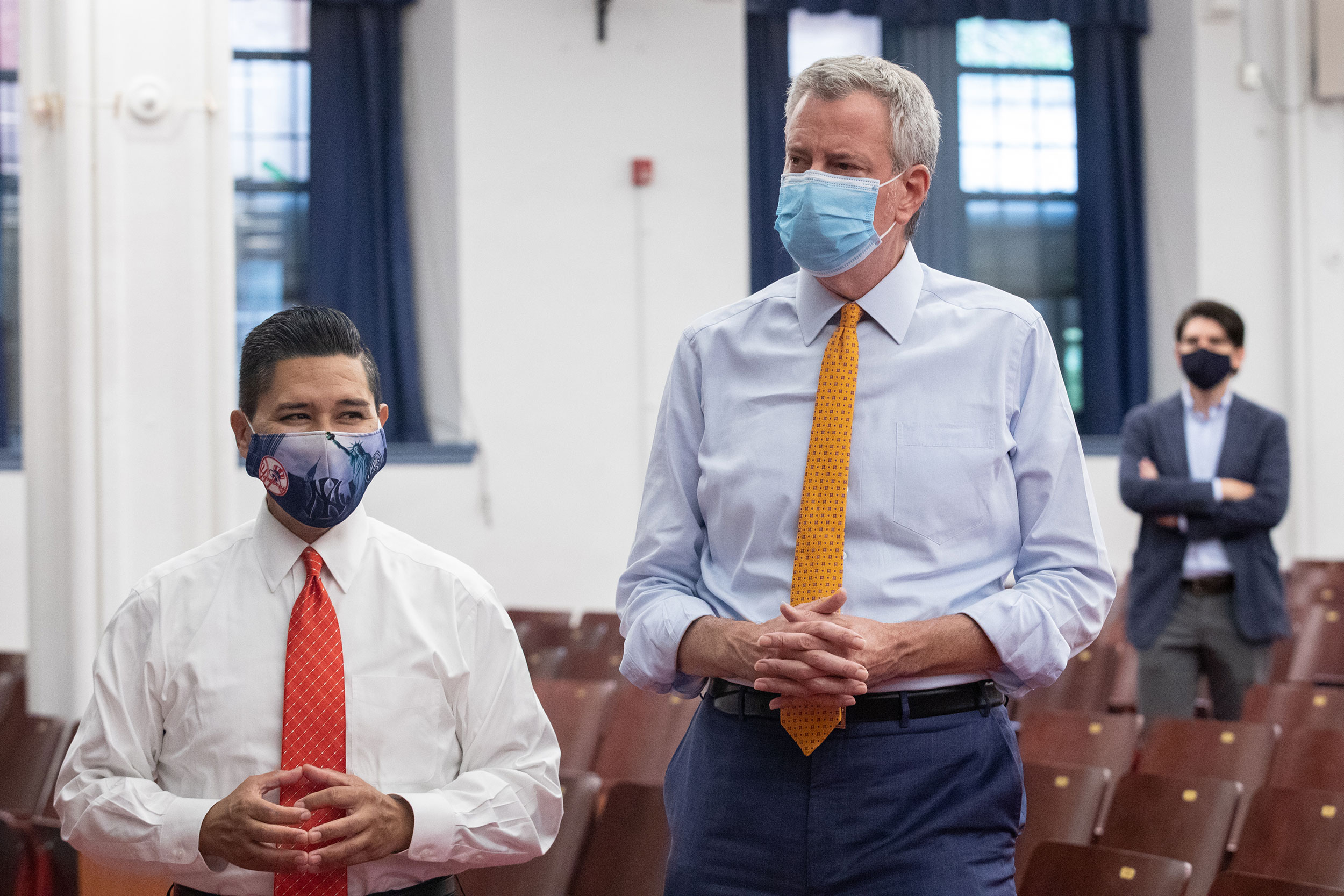 From left, New York City Schools Chancellor Richard Carrnza and Mayor Bill de Blasio attend a news conference at New Bridges Elementary School in Brooklyn on August 19.